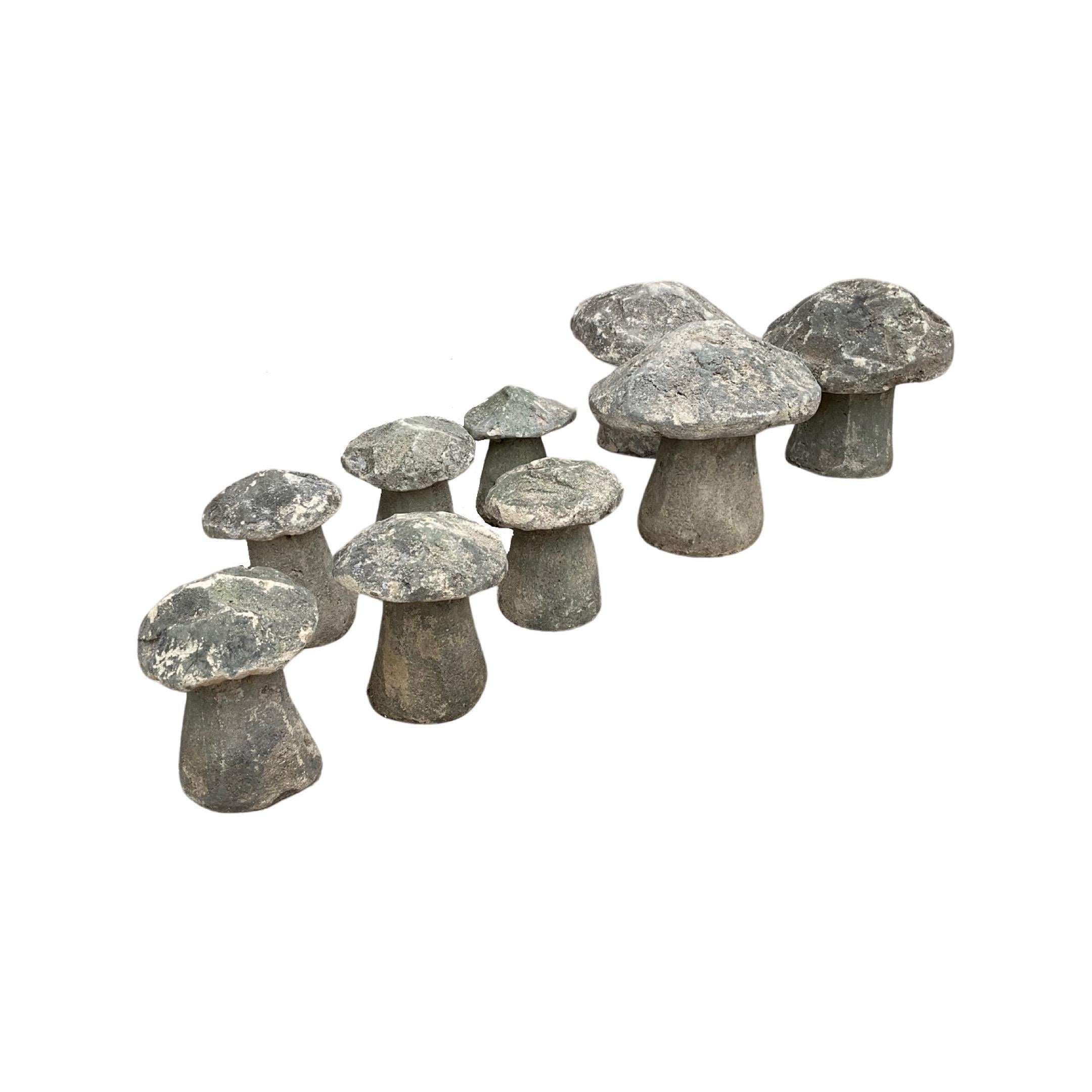 Enhance your outdoor space with this unique set of 9 English limestone mushroom sculptures. Crafted in England circa 1880, these sculptures are made out of durable limestone and feature 6 of the same Size and 3 that are a little taller. Perfect for