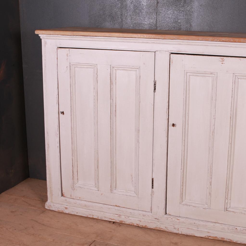 Useful three-door painted linen cupboard, 1890.

Dimensions:
88 inches (224 cms) wide
17.5 inches (44 cms) deep
45 inches (114 cms) high.