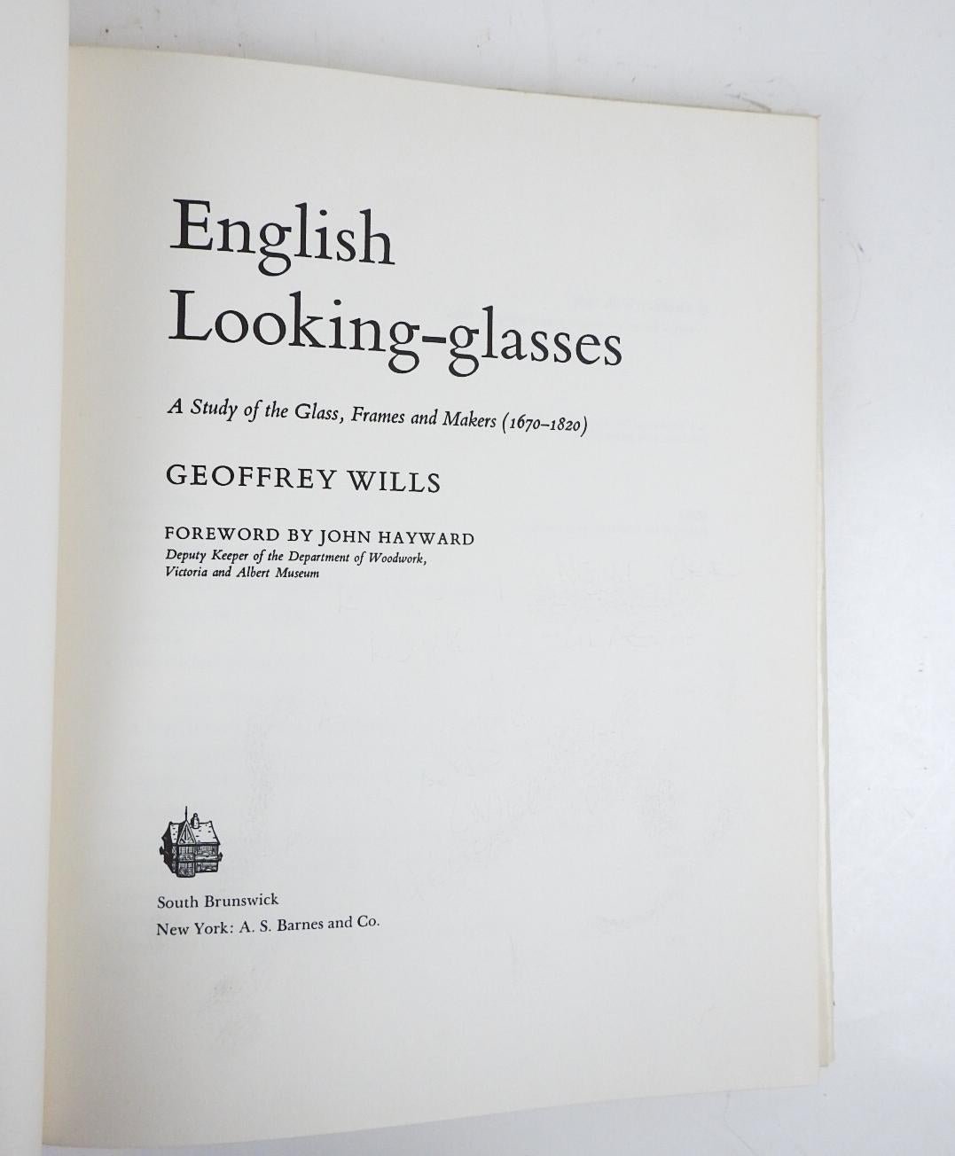 English Looking-Glasses: A Study of the Glass, Frames, and Makers (1670-1820) by Geoffrey Wills.  Published by A.S. Barnes, New York, 1967.  Illustrated dust jacket, white cloth binding, many black and white illustrations, edge wear and small tears
