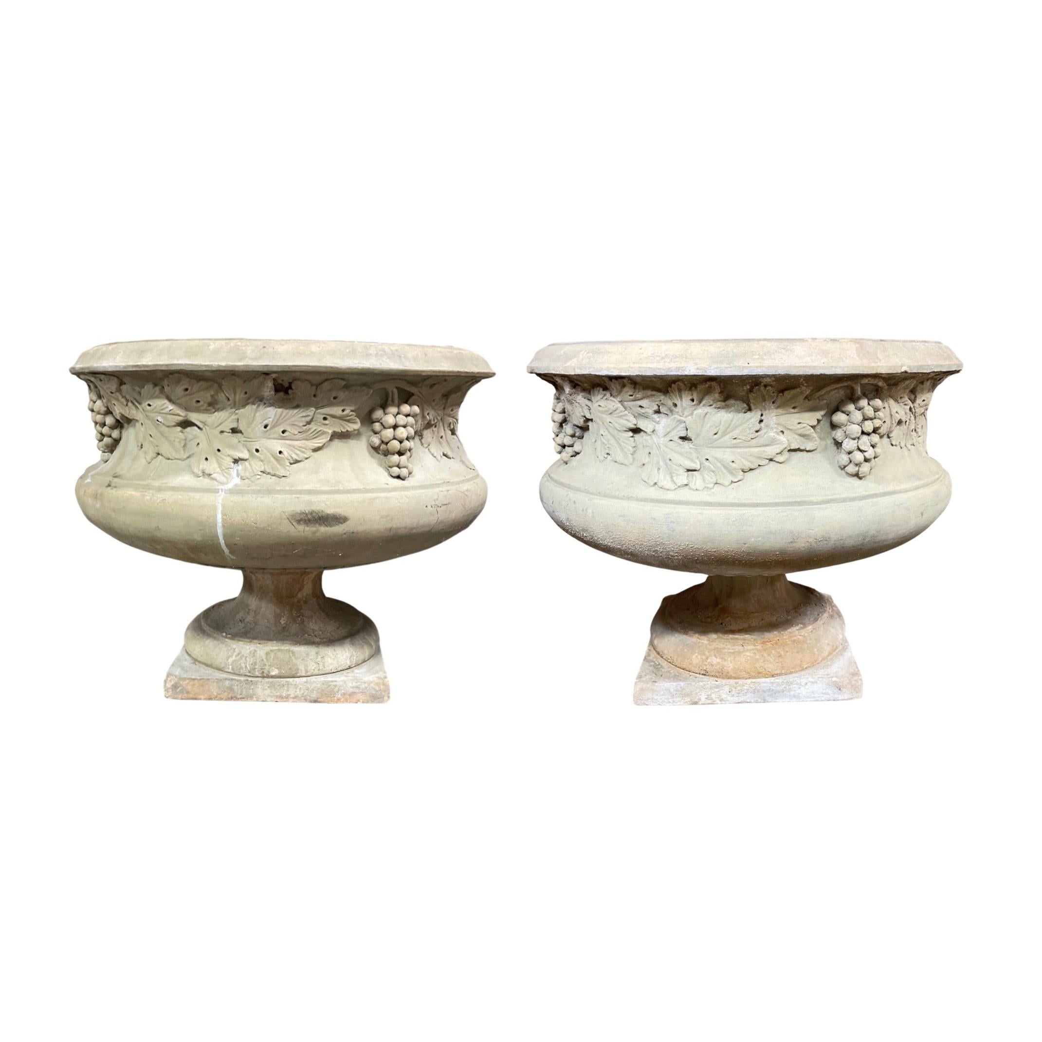 These English Low Line Terracotta Planters make a perfect accent piece for your home. Handmade in England in the 1850s, they are made of durable terracotta and feature intricate carvings of grapes and florals. Add a touch of classic charm to your