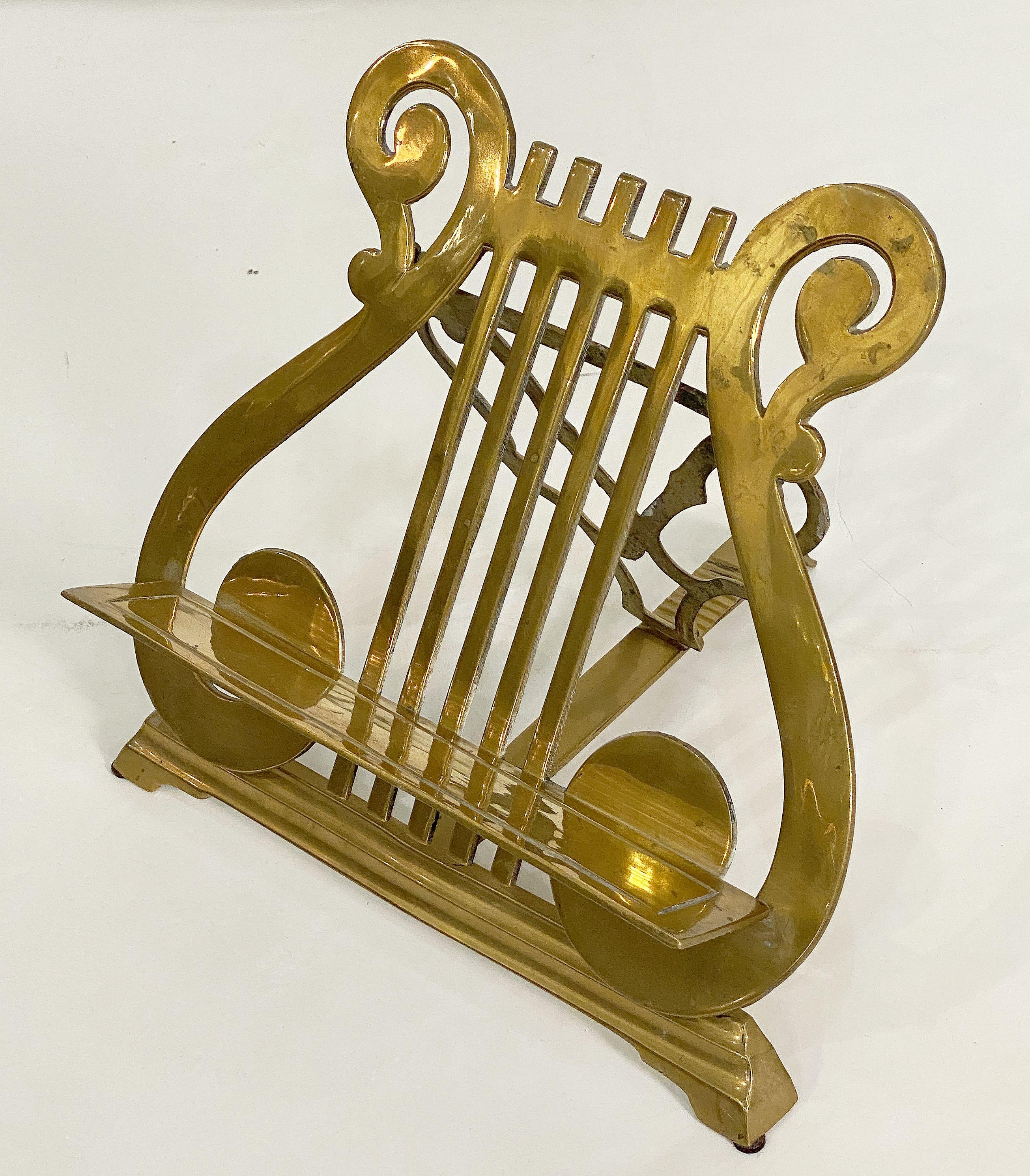 A fine English table top lectern or missal book and music stand of brass from the Edwardian era, featuring a pierced lyre-shaped reading top or back with attached book ledge. The collapsible back attached to a graduated, adjustable base.

Suitable