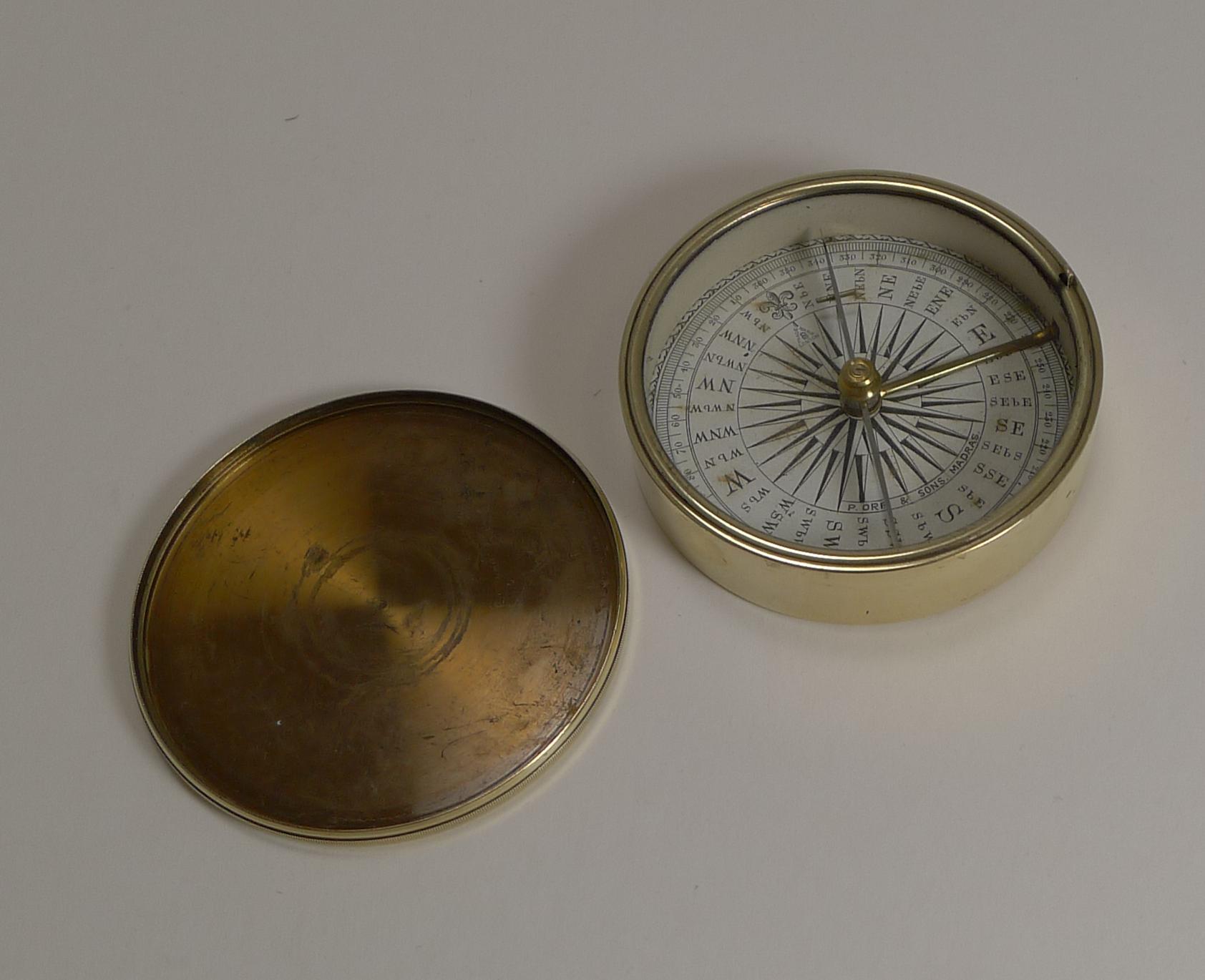 A handsome Victorian pocket / explorer compass with a cross bar needle pivoting on a jewelled bearing above a traditional dial.

Complete in it's brass case and lid and incorporates a transit lock activated when the lid is in place, the compass is
