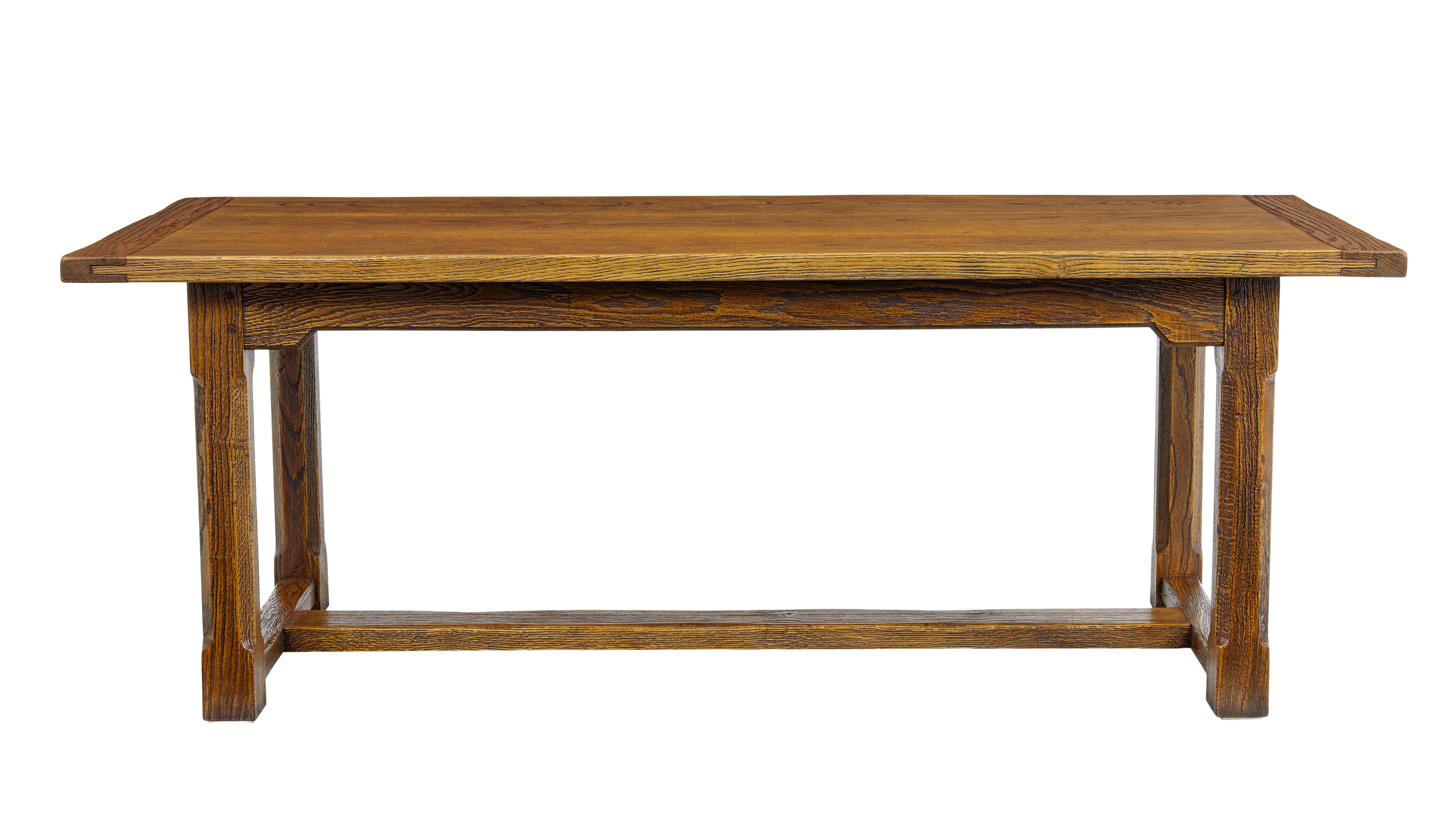 English made golden oak refectory dining table circa 1990.

Made from solid oak and presented with an open grain to the surfaces, sealed in with polish to showcase the rich golden colour.  Seats a comfortable 6-8.  3 plank top with cleated ends. 