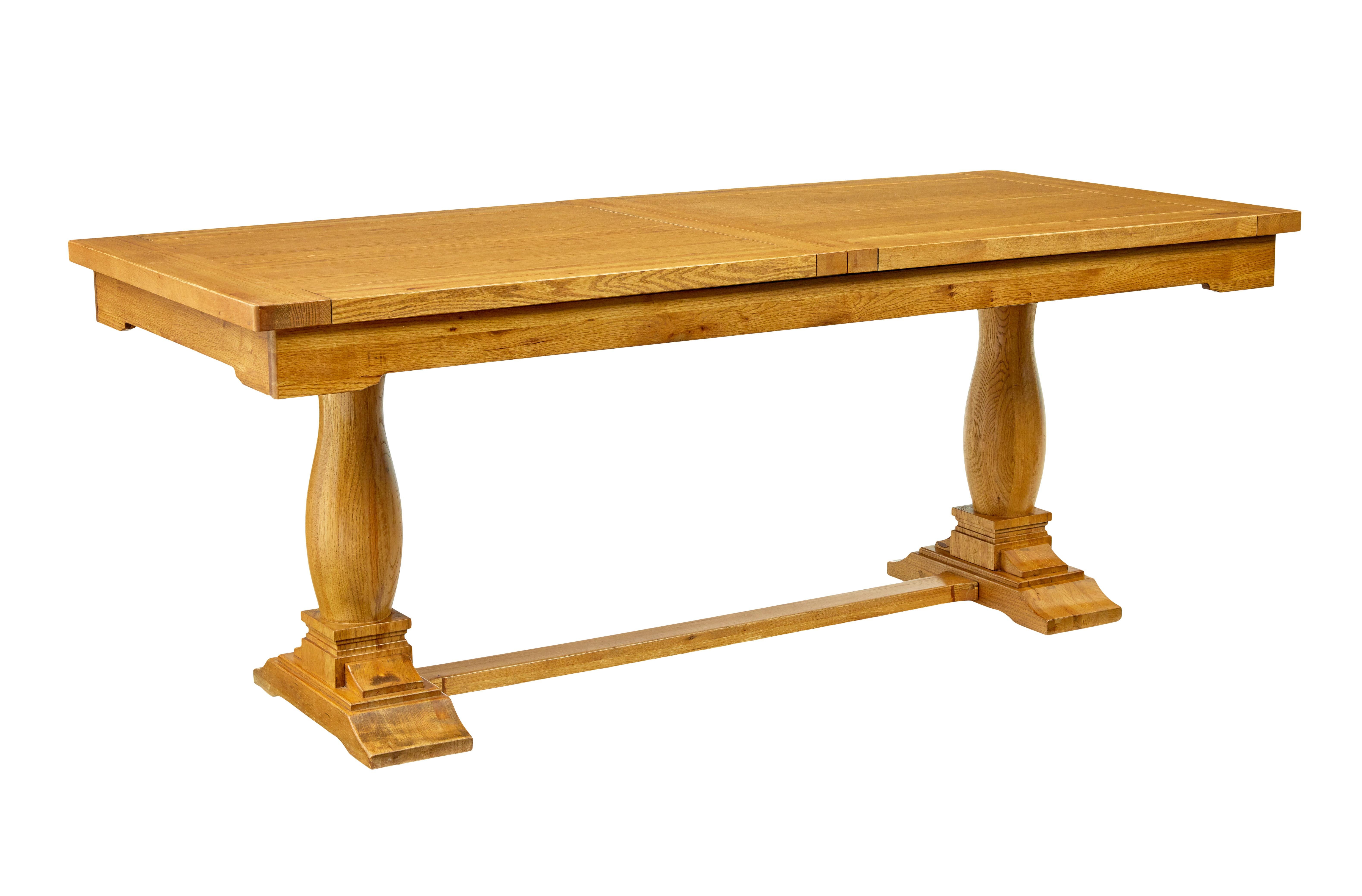 English made solid oak extending dining table.

Good quality solid oak dining table with extending leaf.

Easy pull out mechanism which can be operated comfortably by 1 person, extension is located in a bay below the top surface.  When in place, the