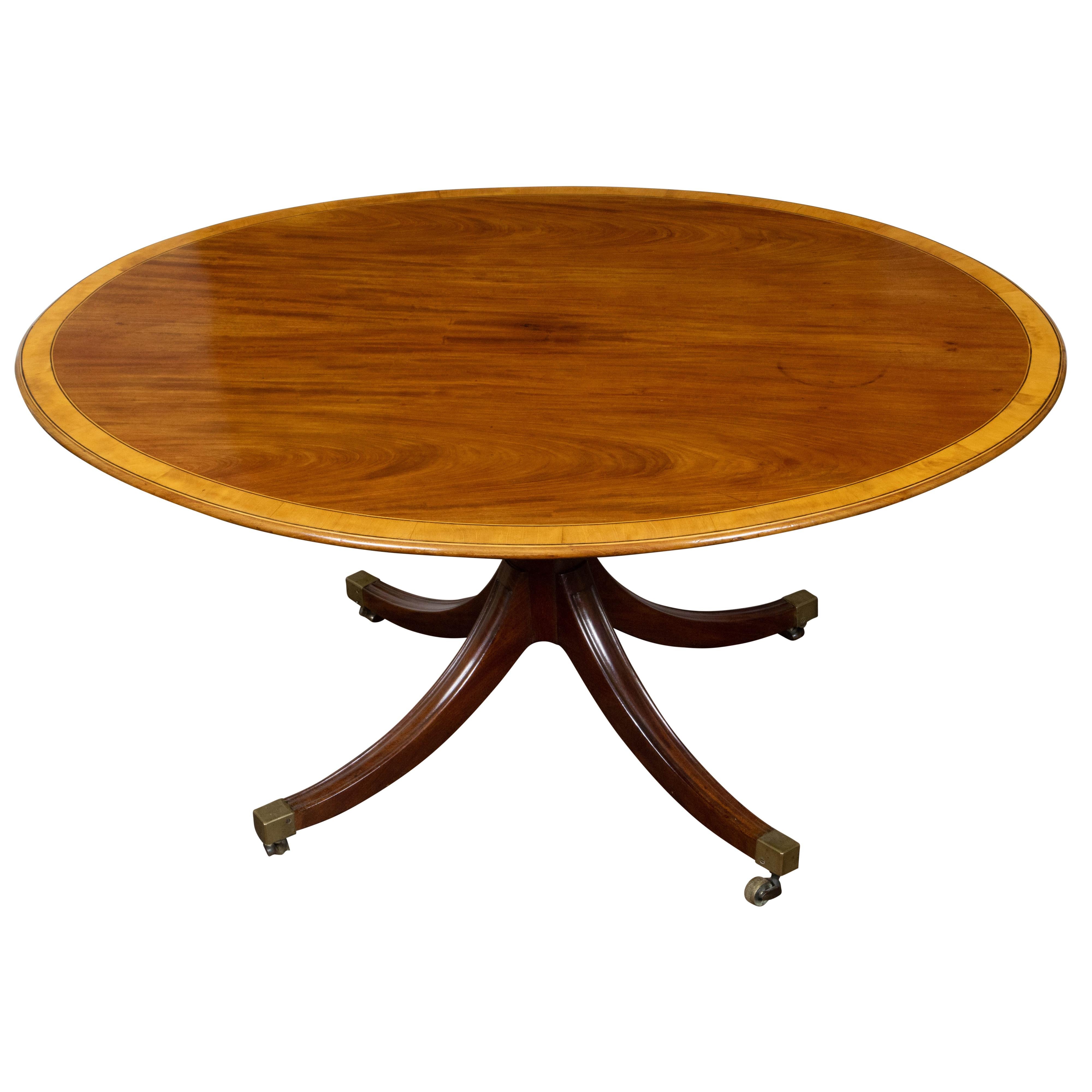 19th Century English Mahogany 1840s Oval Top Pedestal Table with Quadripod Base and Casters For Sale