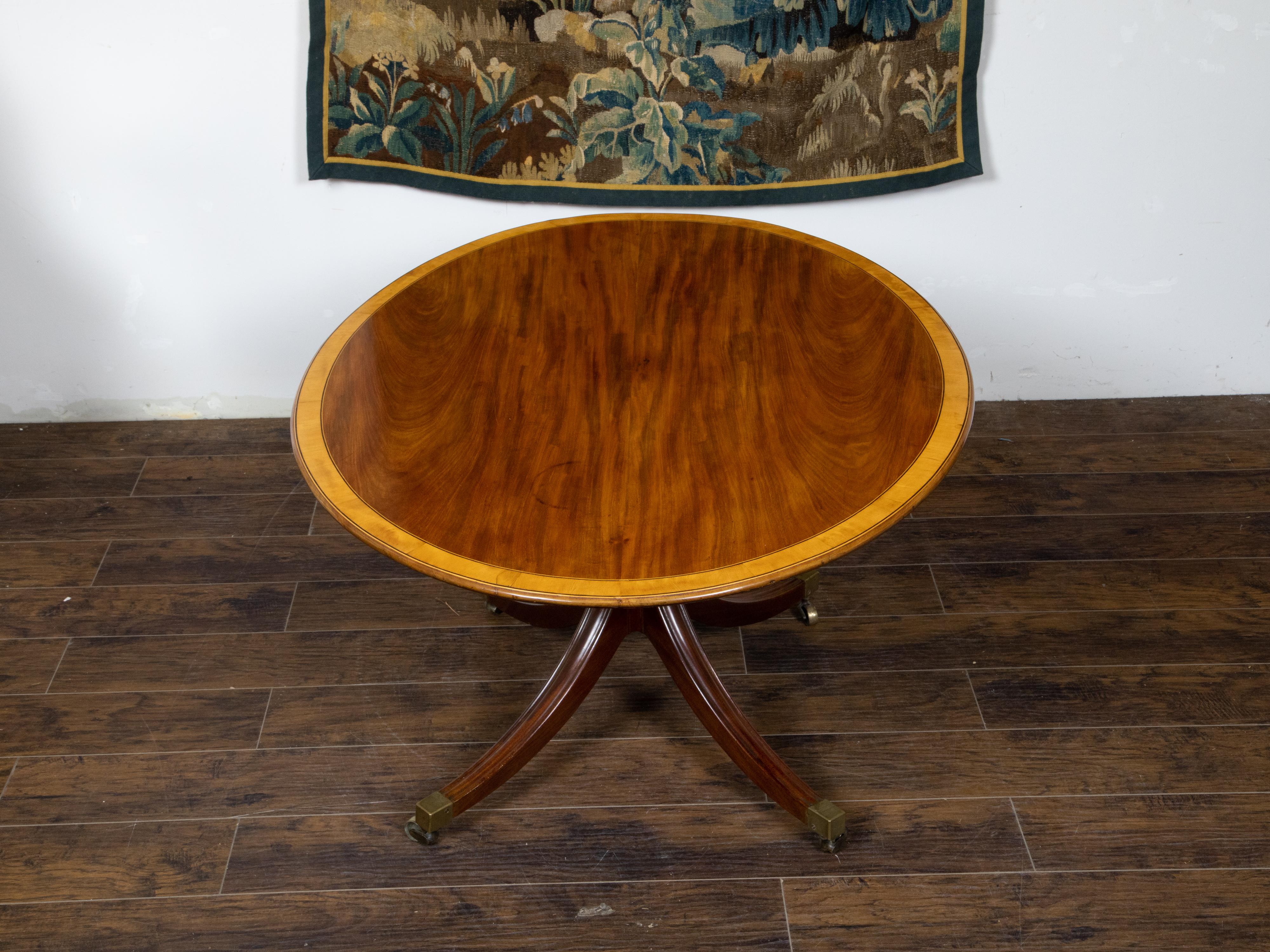 English Mahogany 1840s Oval Top Pedestal Table with Quadripod Base and Casters For Sale 1