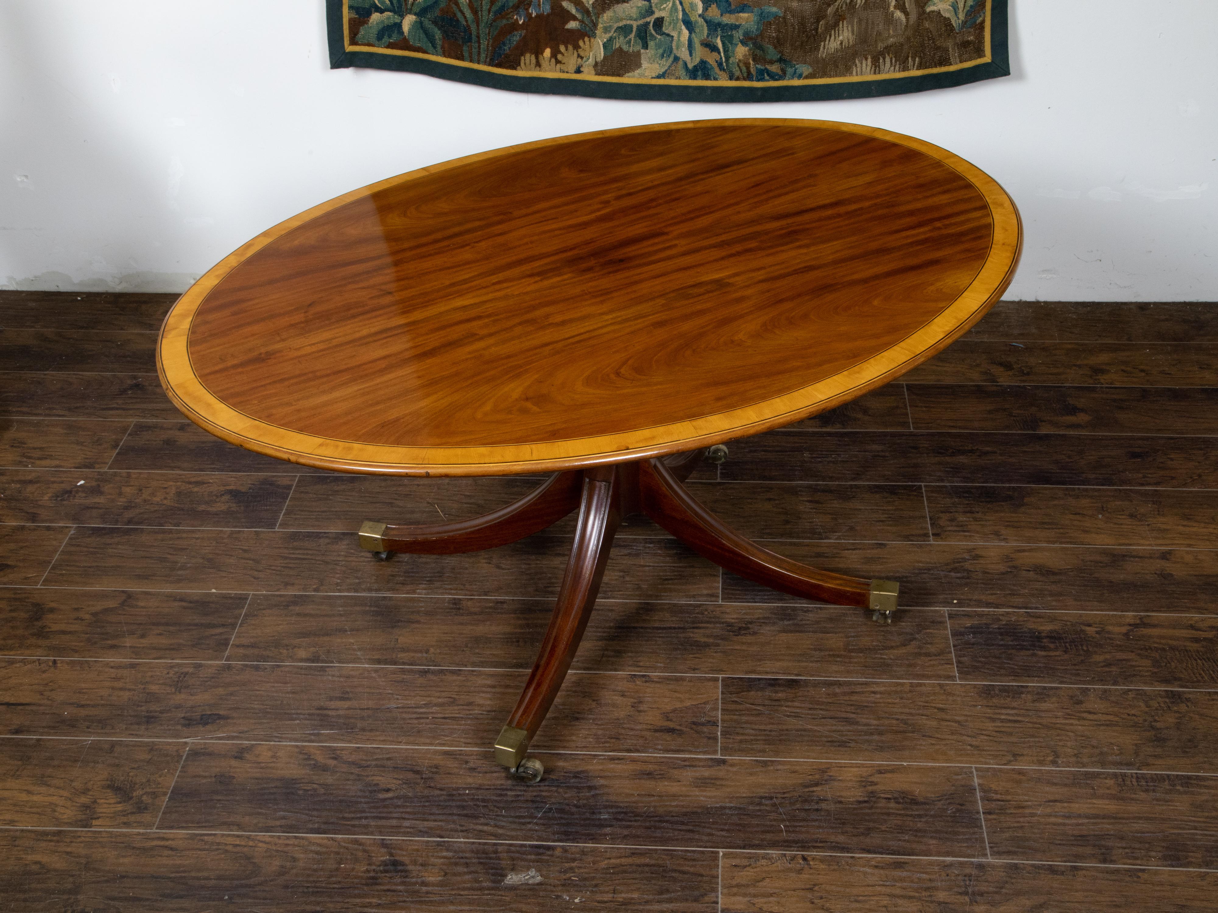 English Mahogany 1840s Oval Top Pedestal Table with Quadripod Base and Casters For Sale 2