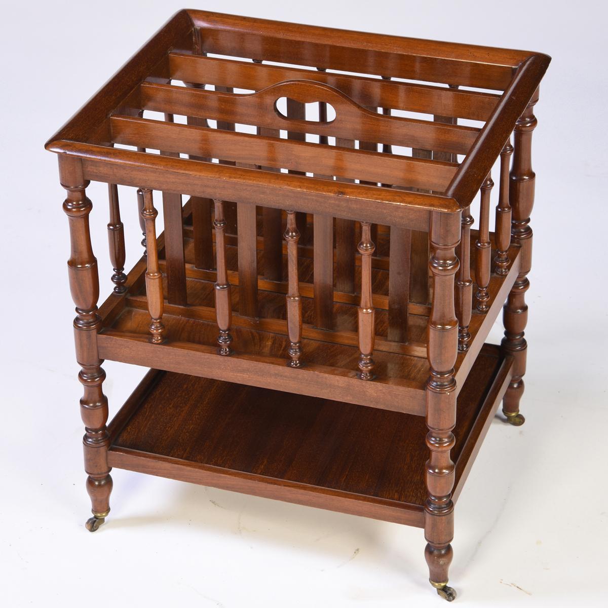 Antique English mahogany 4 division music canterbury. It has well-turned legs and outer spindles and a useful tray shelf below. In remarkably fine condition, circa 1840.