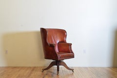English Mahogany and Leather Upholstered Swivel Wing Chair