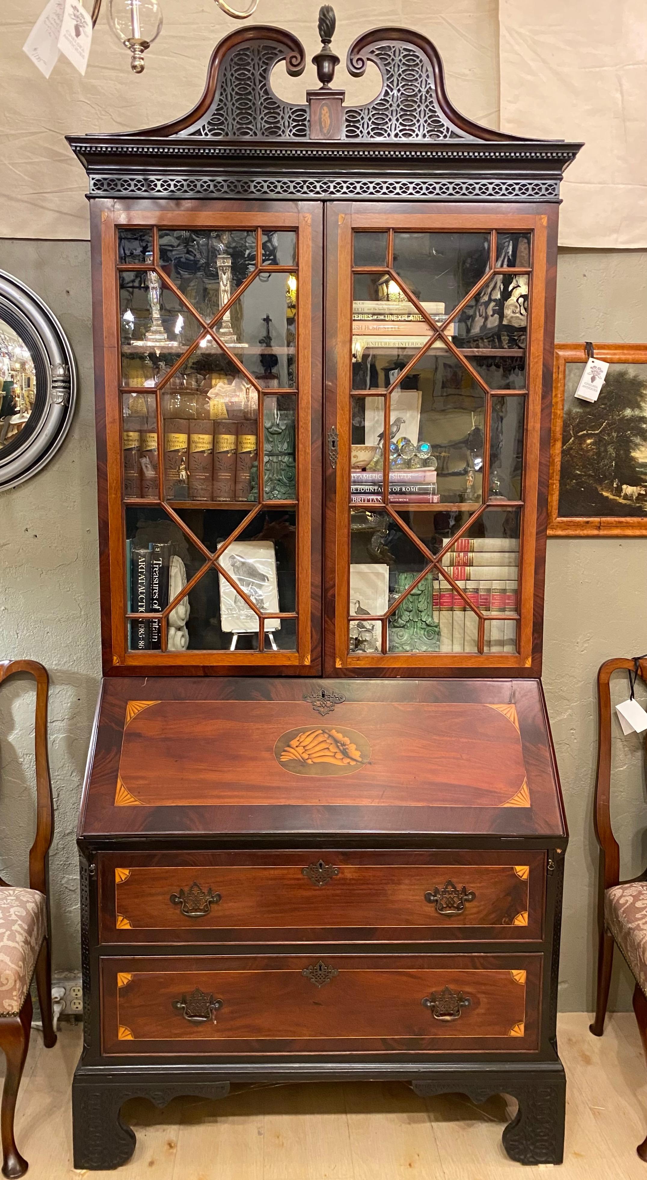 An eccentric and highly unusual Classic Sheraton style mahogany and satinwood inlay slant front secretary with Chinese Chippendale style fine tracery (open-work) decoration.
An impressive possibly one of a kind mahogany secretary-desk-bookcase with