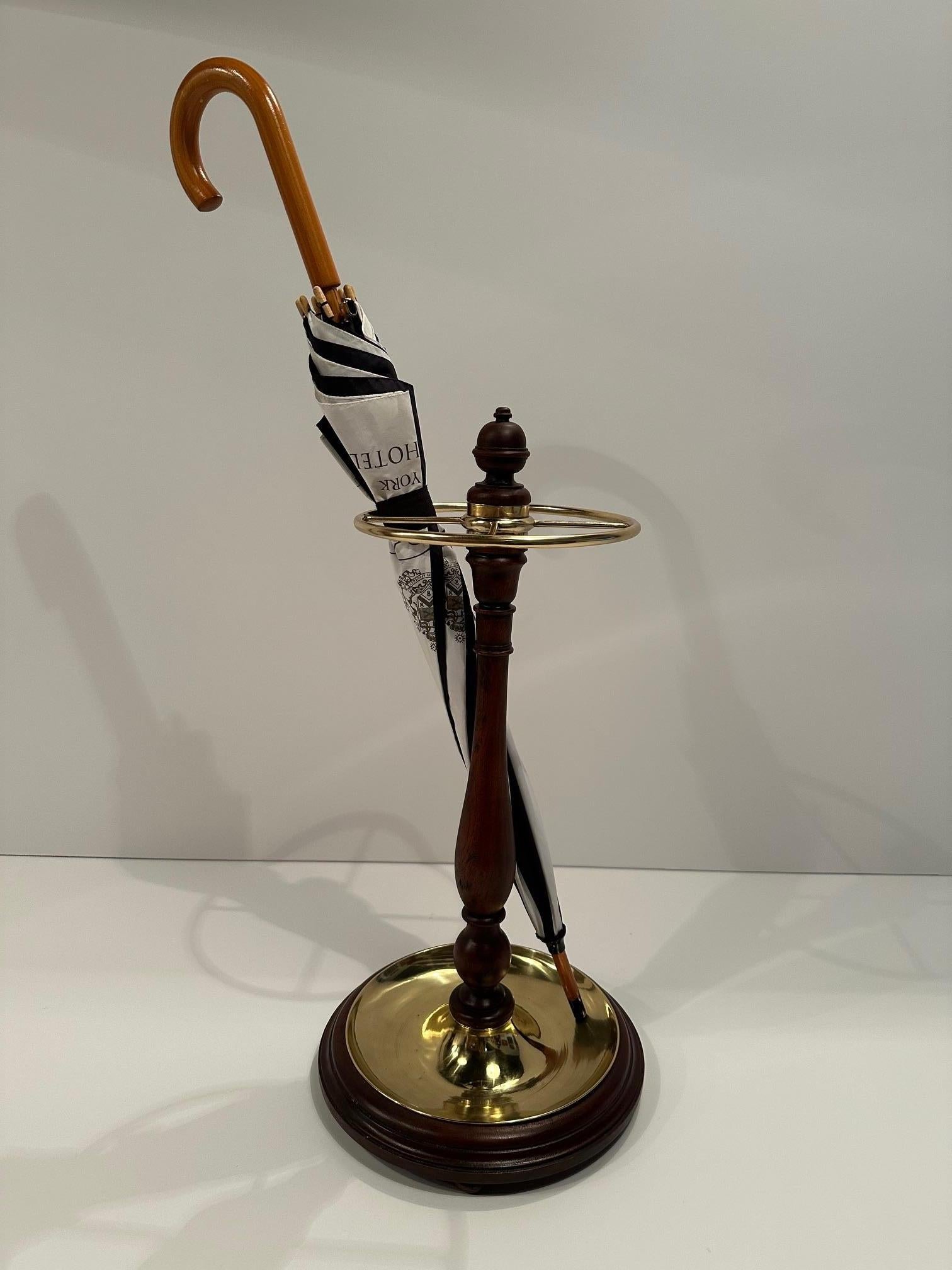 Handsome and elegant antique mahogany and brass umbrella stand.  Perfect for walking sticks too.
9” diameter at the top