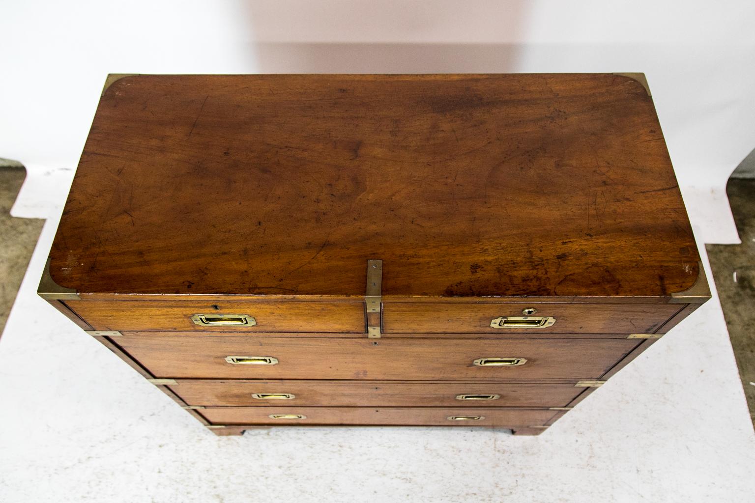 This Campaign chest has the original flush brass hardware in the corners. The drawers have incised cockbeaded edges. The chest comes in its original two sections. All of the original locks are present except for the top right drawer.
   