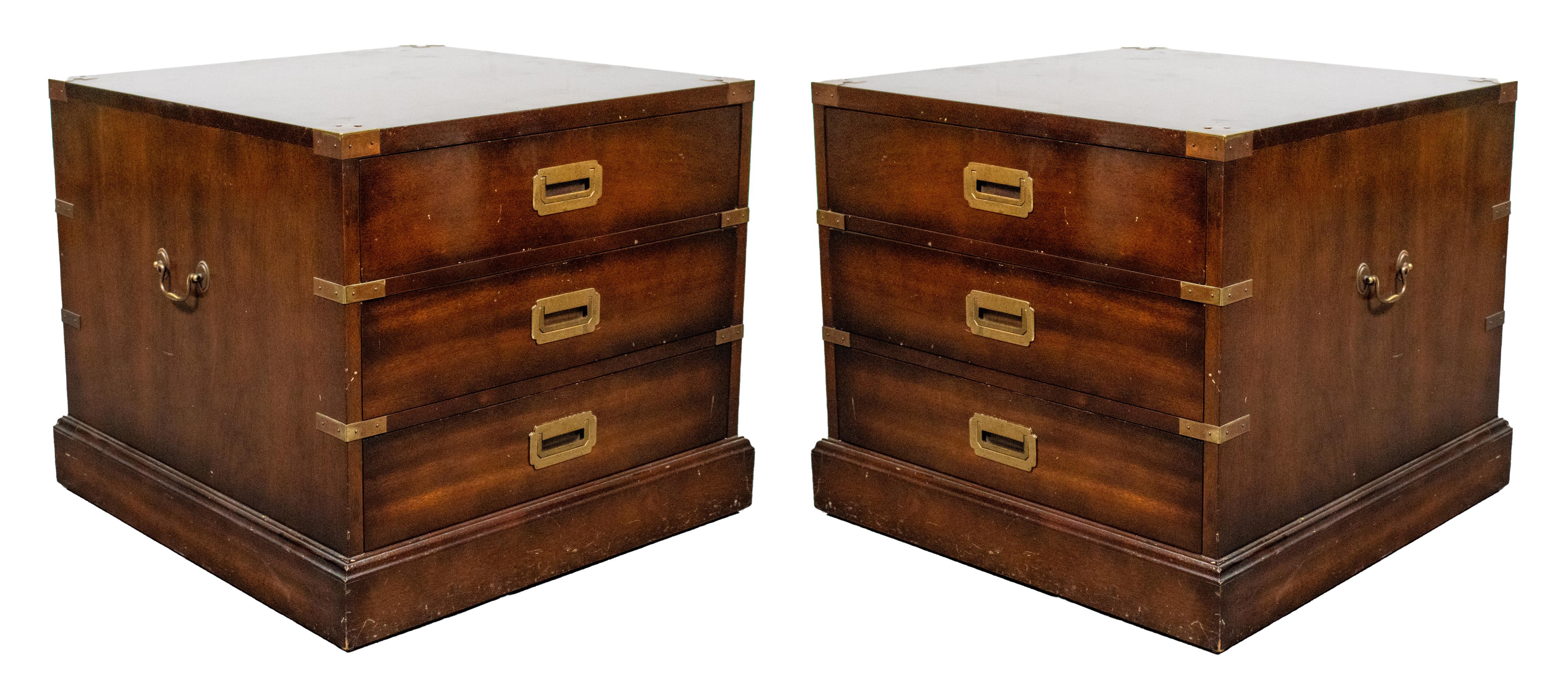 Pair of English mahogany campaign chest of three drawers, brass mounted and with swing pulls, handles at sides. 
Measures: 22
