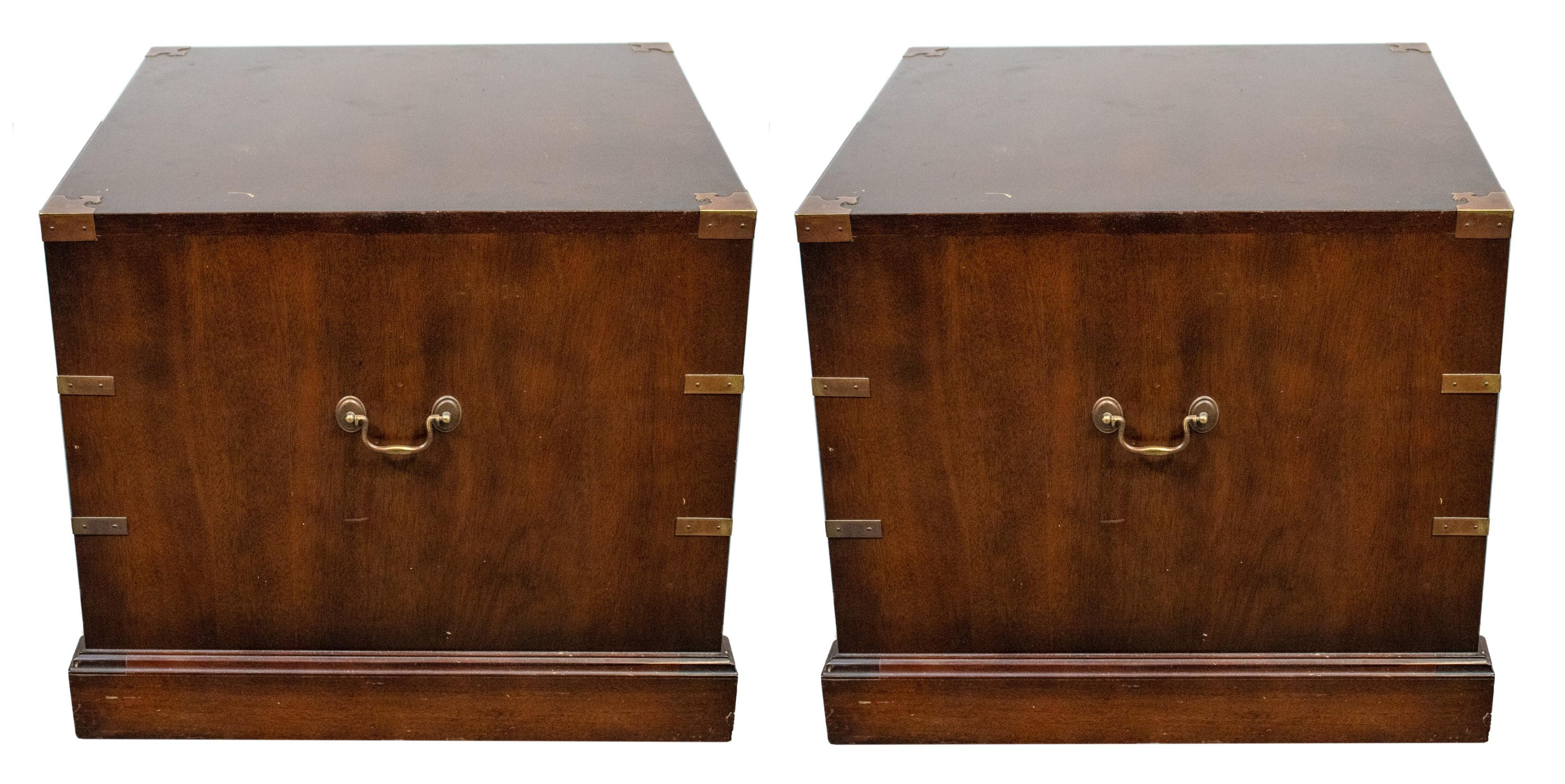 English mahogany campaign chests with three drawers each. Here's the information:

Style: Campaign
Material: Mahogany
Features:
Three drawers
Brass mounted
Swing pulls
Handles at the sides for portability
Dimensions (for each chest):
Height (H): 22