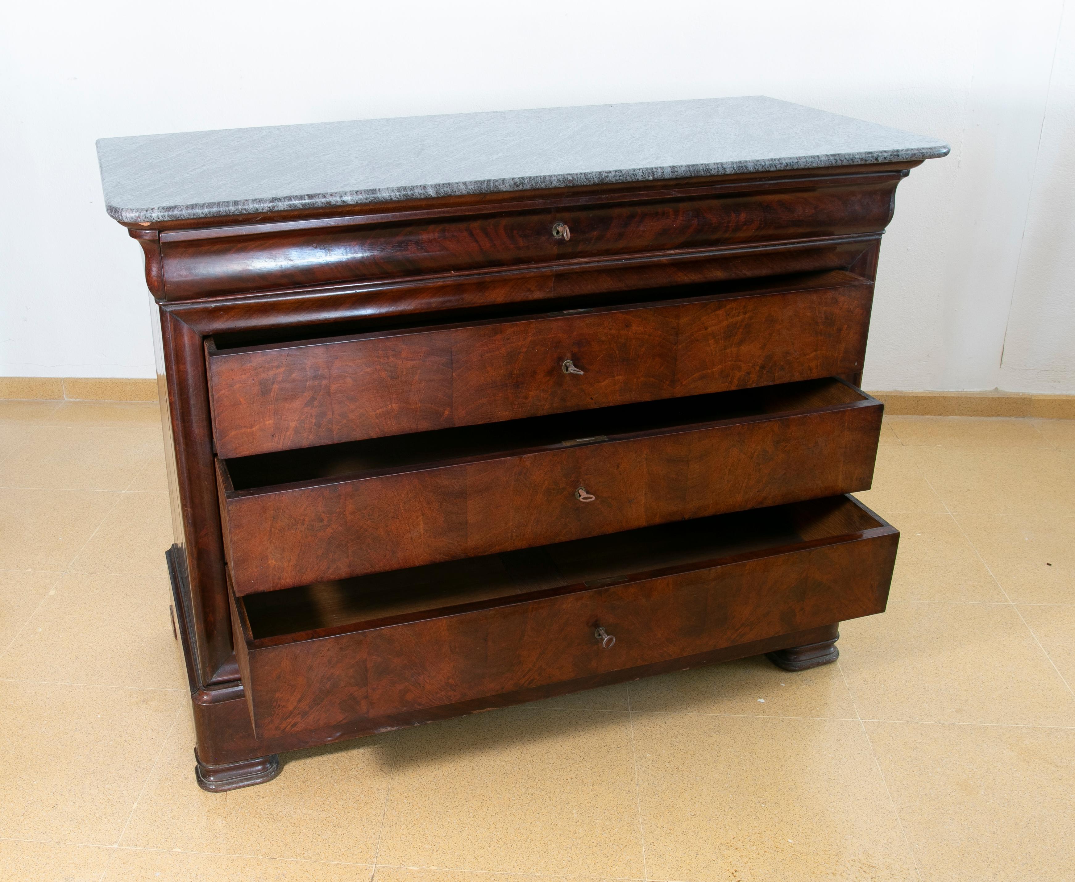 English mahogany chest of drawers with four drawers and marble top.