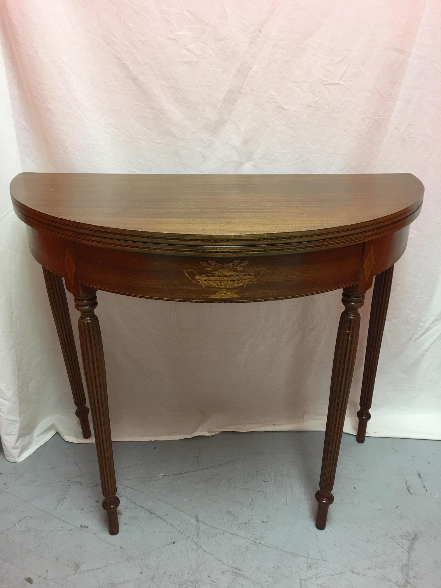 English mahogany demilune table or center table, 19th century.
 