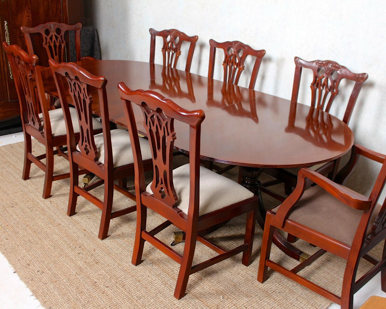 An impressive antique nine piece mahogany dining suite.
The chairs with carved and pierced backrests, slip seats and raised on carved legs united by stretchers.
The twin stalker table extending by way of spare leaf and raised on baluster columns,
