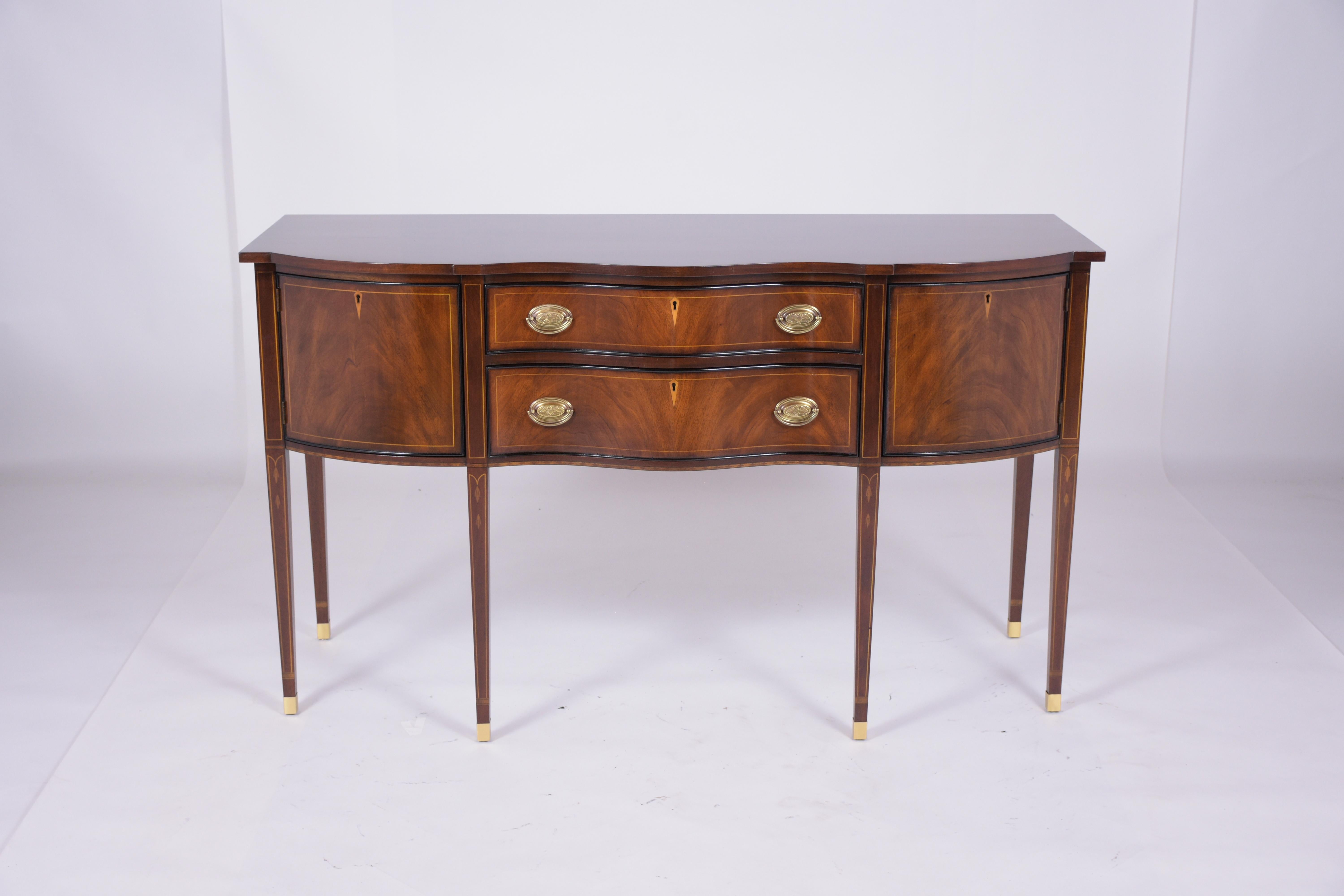 An extraordinary antique George III English sideboard beautiful crafted out mahogany wood has been professionally restored by our craftsmen team. This fabulous piece features its original mahogany color and ebonized moldings finish accents details