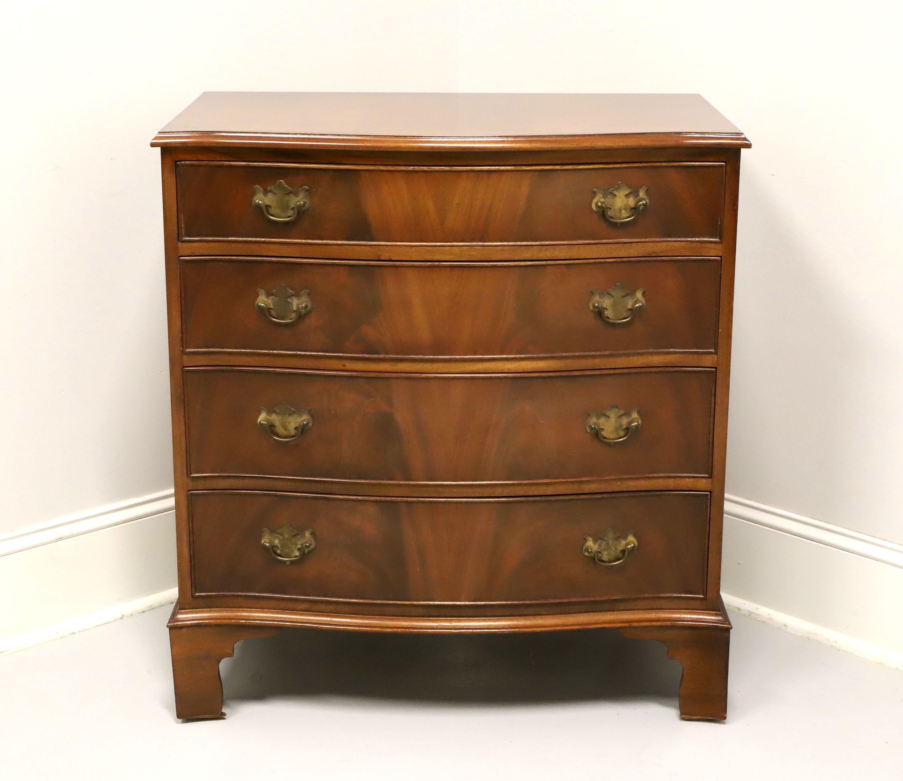 A bachelor chest in the Georgian style, though unmarked, most likely by Bevan Funnell Reprodux. Mahogany with flame mahogany drawer fronts, serpentine front, brass hardware and bracket feet. Features four drawers of dovetail construction. Made in