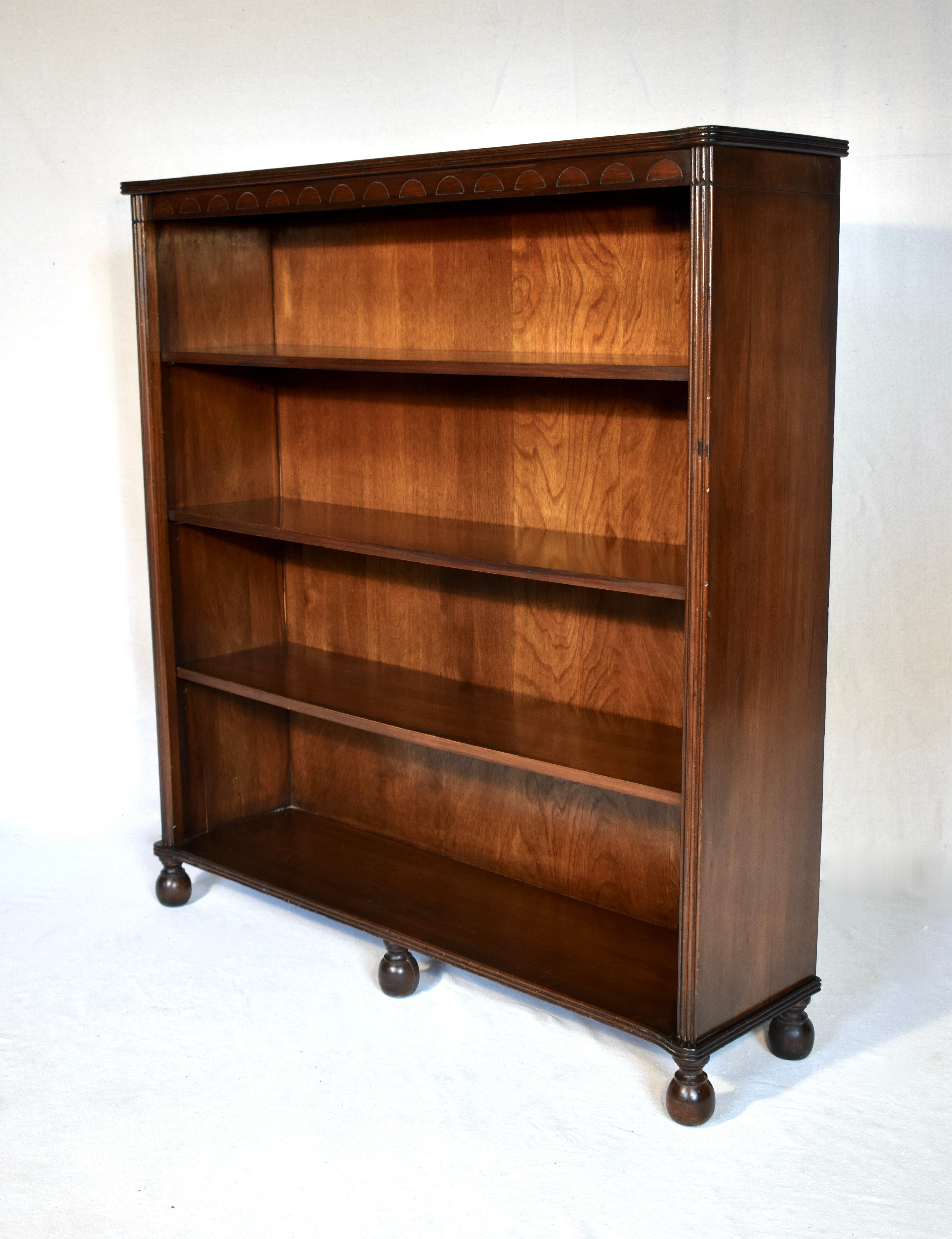 Generous size solid Mahogany open bookcase with three adjustable shelves & interesting cannonball feet. Marvelous transitional piece suitable for use in traditional or modern settings.