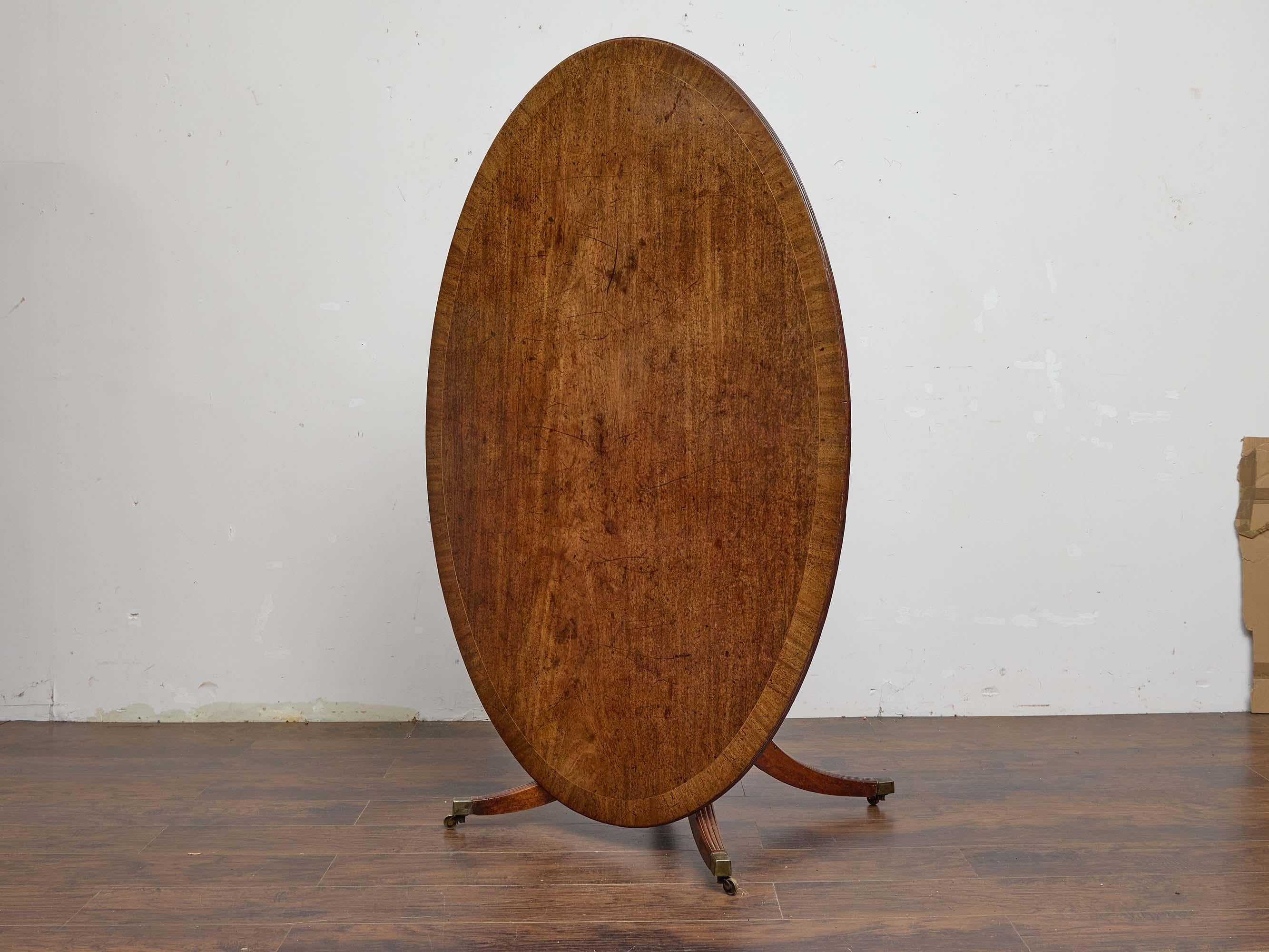 Mesa inclinada ovalada inglesa de caoba con patas de caña, principios del siglo XIX Regencia en venta