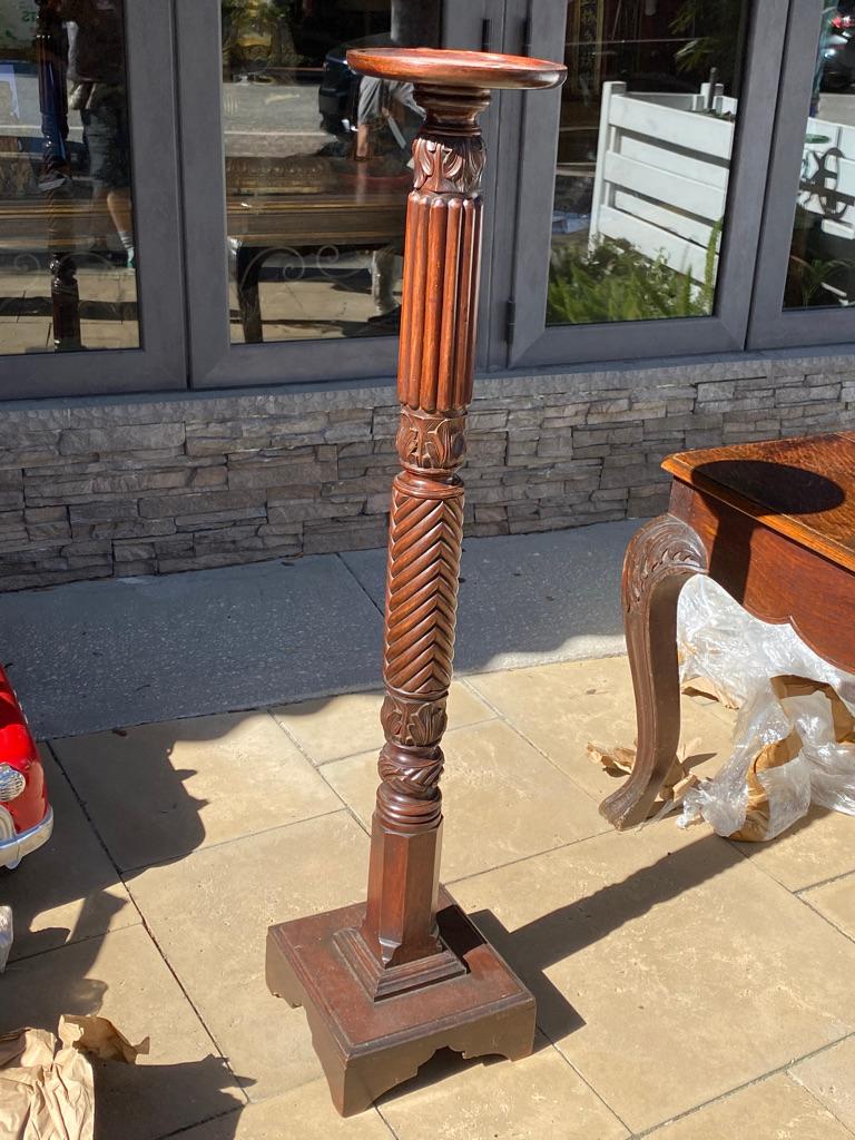 Hand crafted English mahogany plant stand made from a column beautifully hand carved.