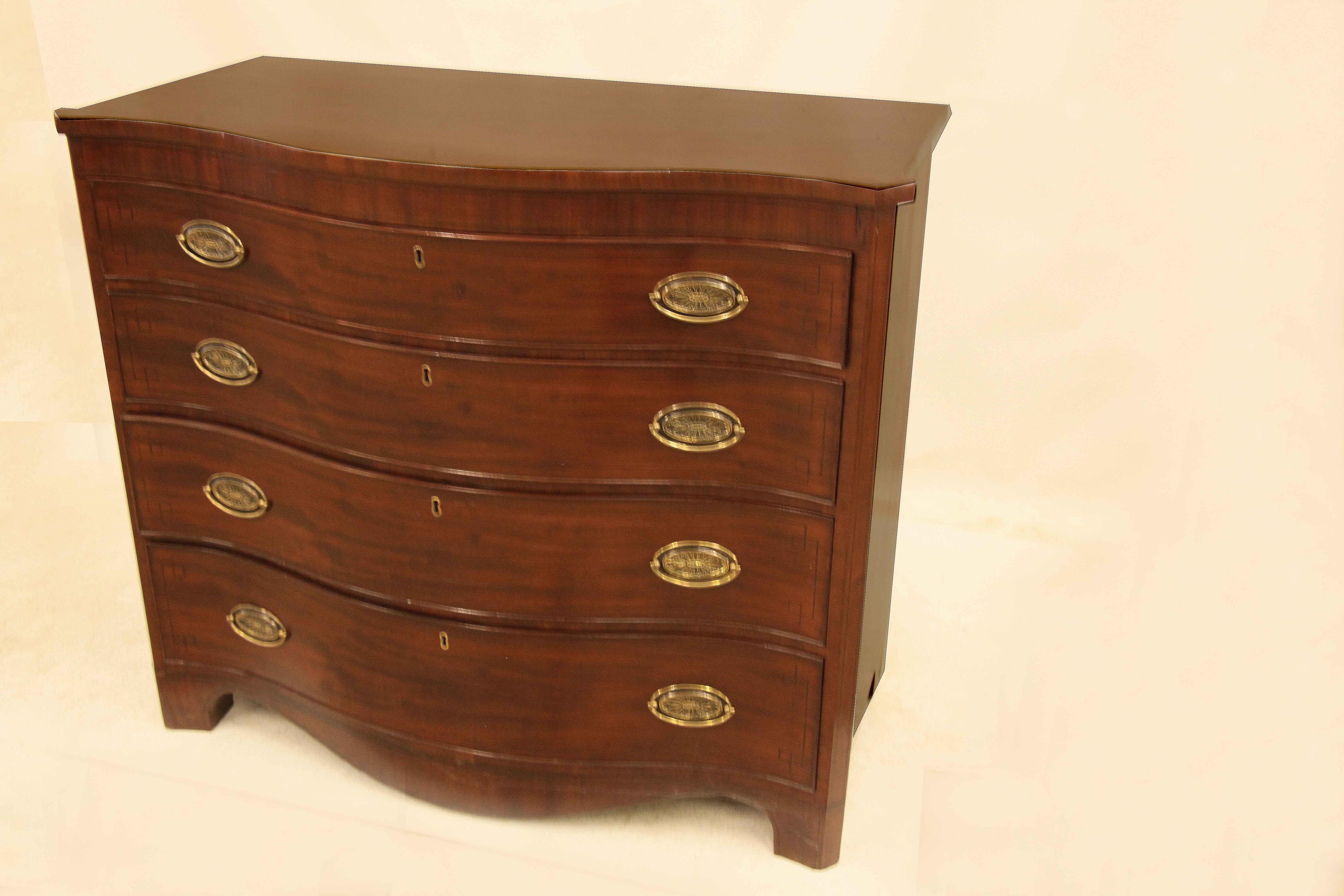 Early 19th Century English Mahogany Serpentine Chest For Sale