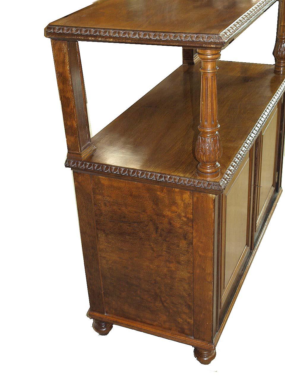 English mahogany two tier server, the top is supported in the front by carved and fluted columns and molded pilasters in the rear, both top and lower surface have beautifully carved molding. The sides feature the highly desirable ''plum pudding''