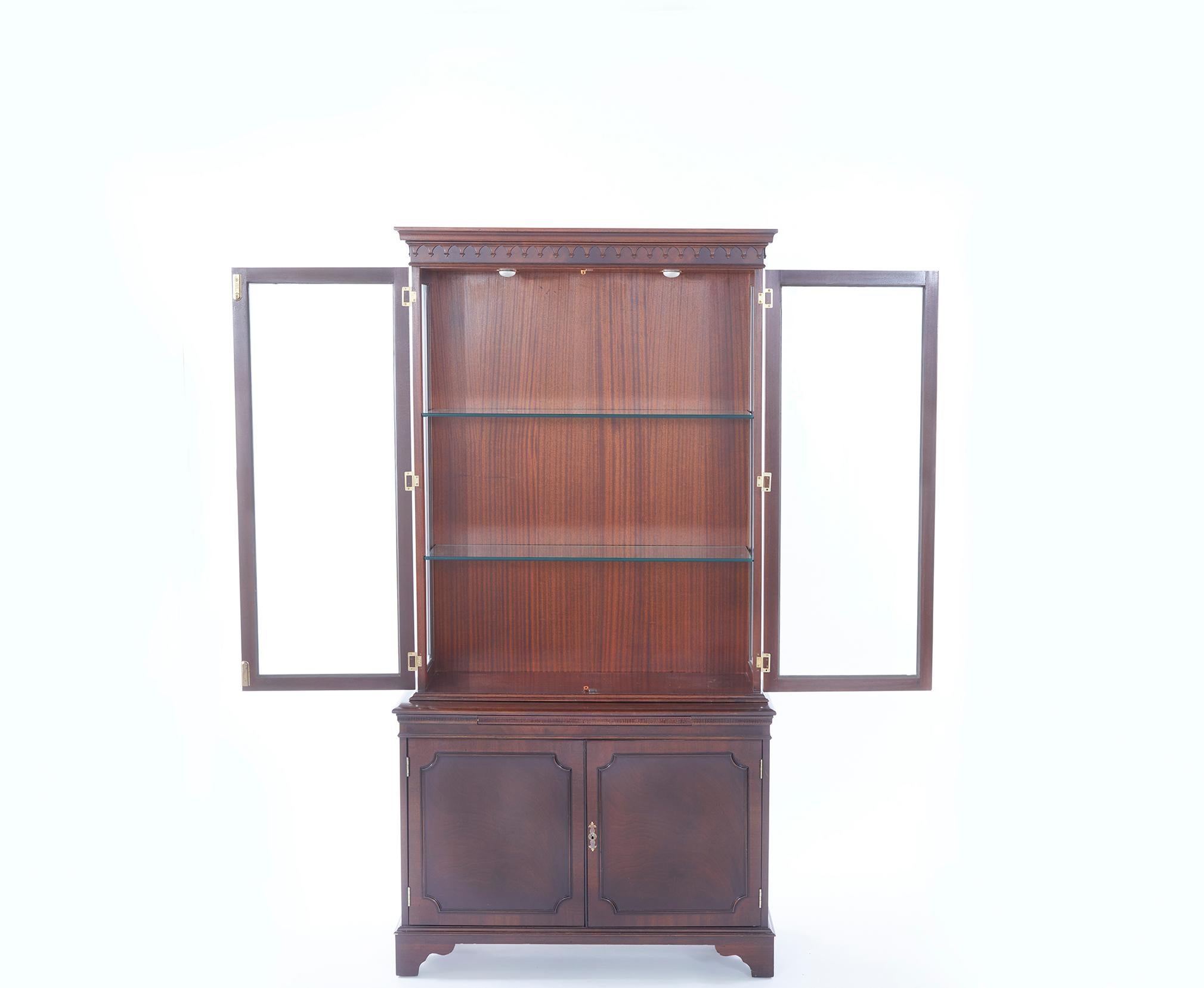 Great English craftsmanship two parts mahogany wood china cabinet / bookcase with interior glass shelves & exterior Greek key influence wood design detail. The hutch / bookcase is very sturdy & in good condition with minor wear consistent with age /