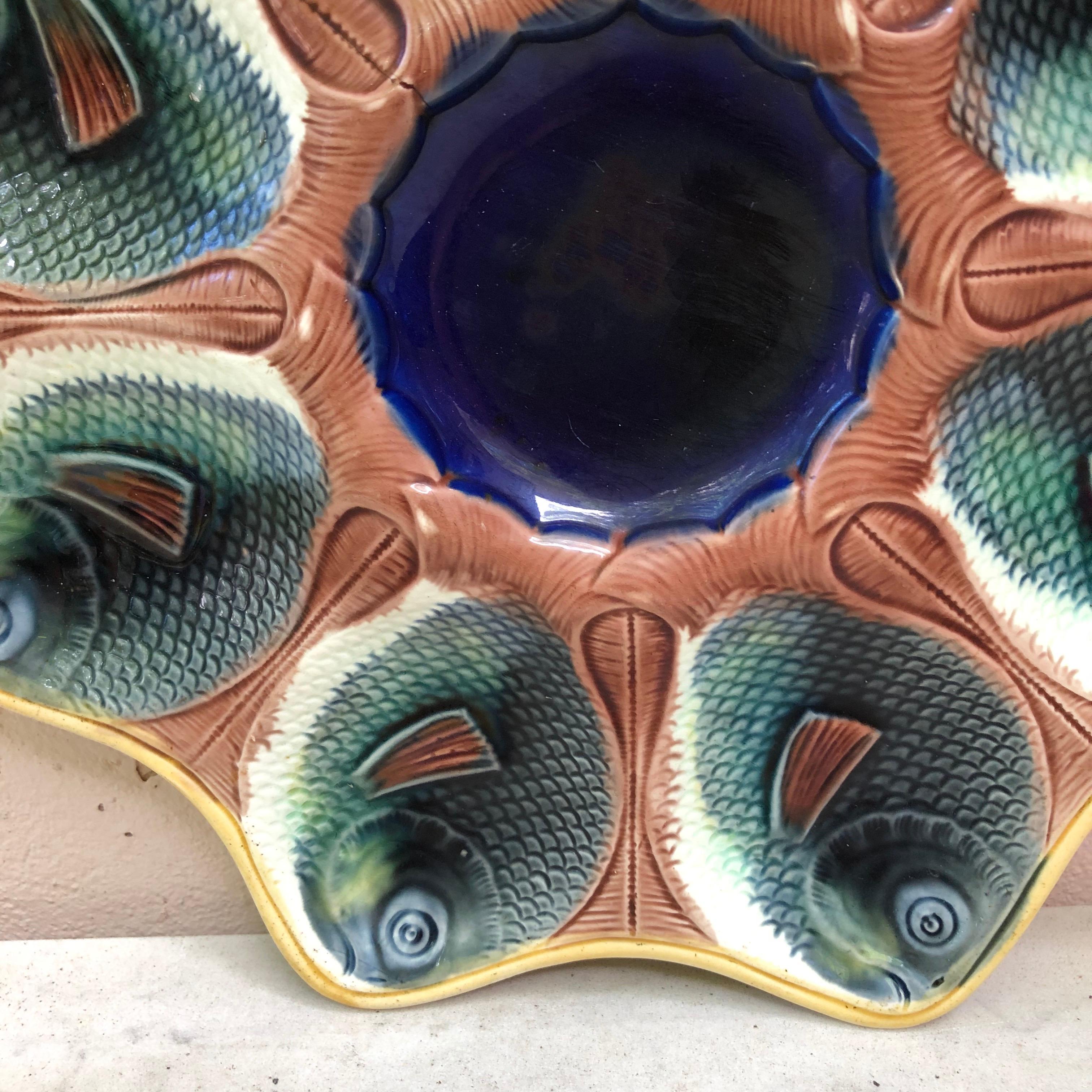 English Majolica fish heads oyster plate, circa 1890.