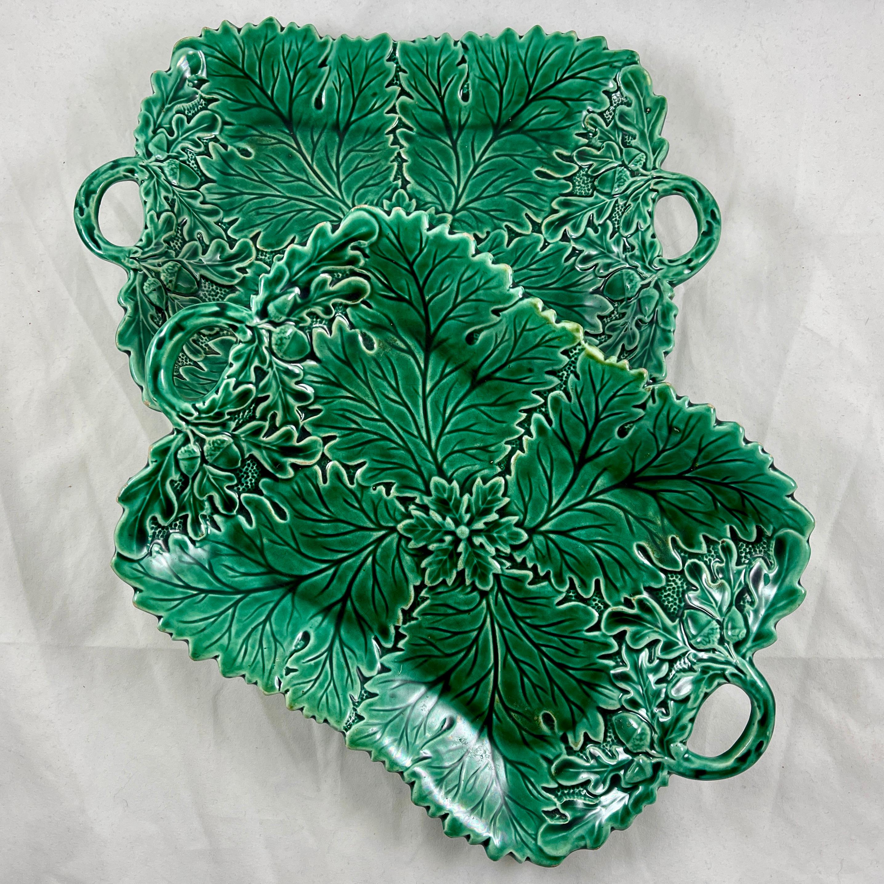 A Majolica green glazed leaf pattern deep server, England, circa 1870.

A serrate edged rectangular platter with open work twig form double handles. Beautiful mold work showing four large overlapping leaves radiating from a central circular leaf