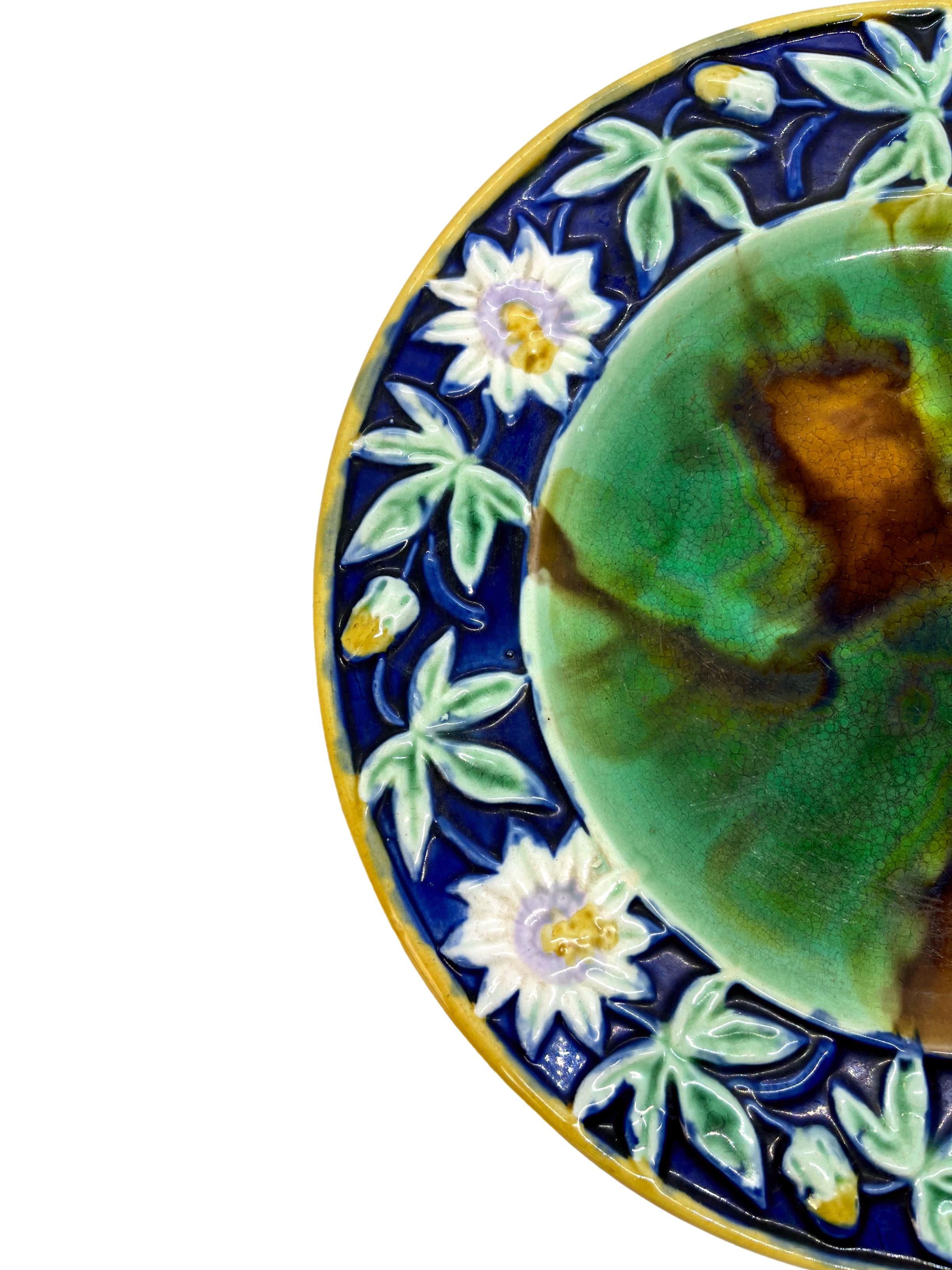 English majolica plate with relief-molded passion flowers and cobalt blue border, ca. 1880.
For thirty years, we have been among the world's preeminent specialists in fine antique majolica.