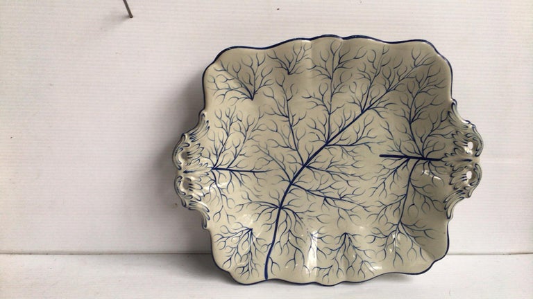 English Majolica rectangular blue and white platter, circa 1890.
Painted branches.
Measures: Length / 11 inches on 9, Height / 1.5 inches.