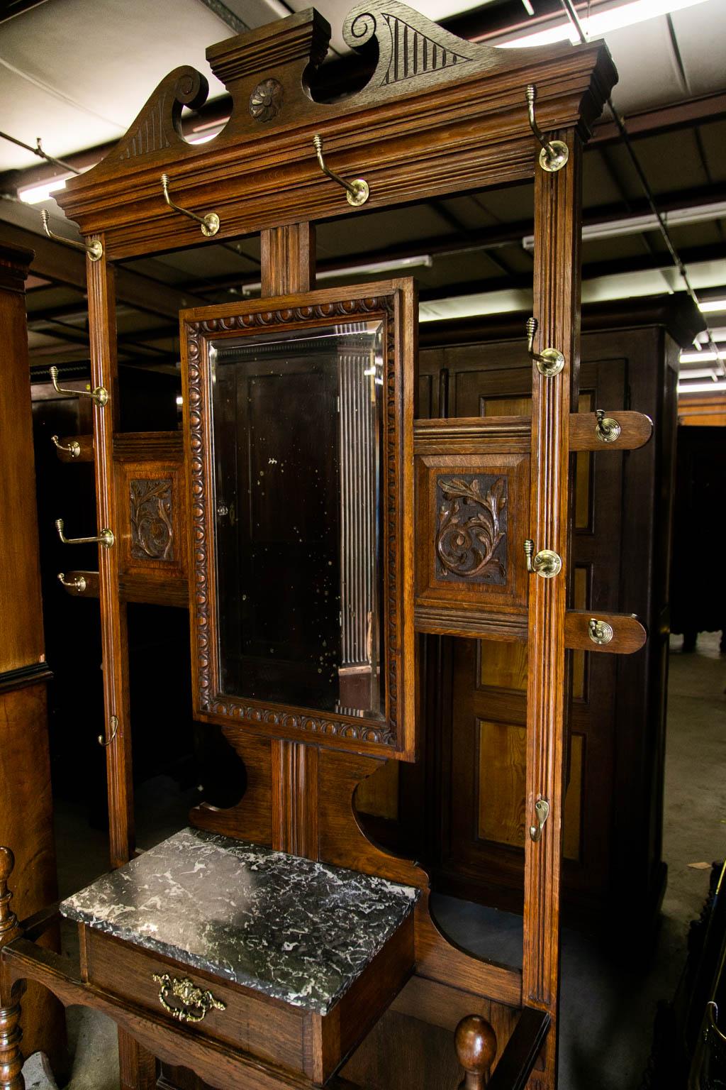 antique hall tree with mirror and marble