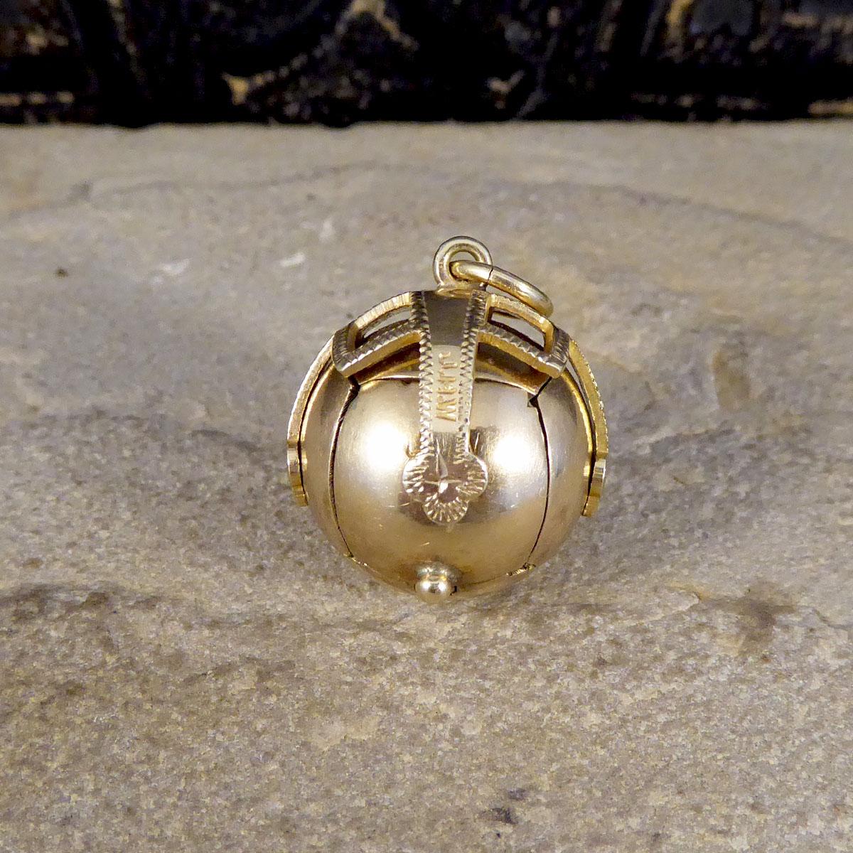 This lovely folding orb pendant appears initially to be a sphere, however when unhinged opens out to show a cross shape formed by six pyramids. On these, are a variety of masonic symbols including the tools of stonemasons to represent moral values