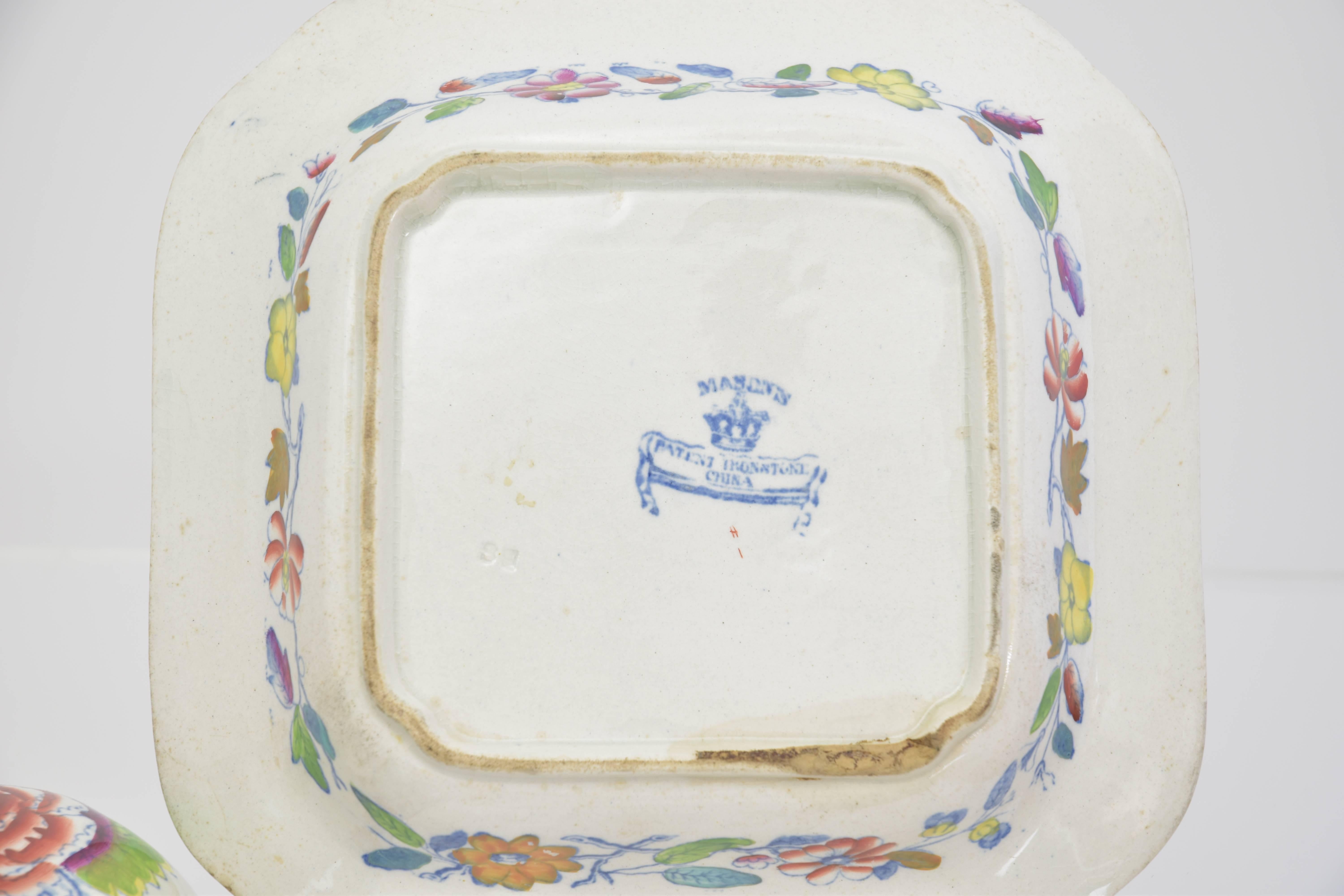 Covered dish in a square shape with flying bird and floral decoration.
