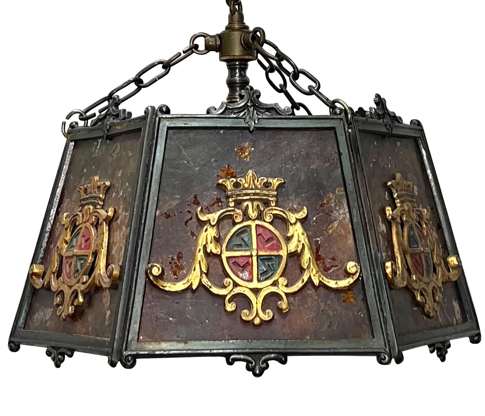 An English circa 1920's patinated bronze and mica lantern with coat-of-arms on side pannels.

Measurements:
Diameter: 13