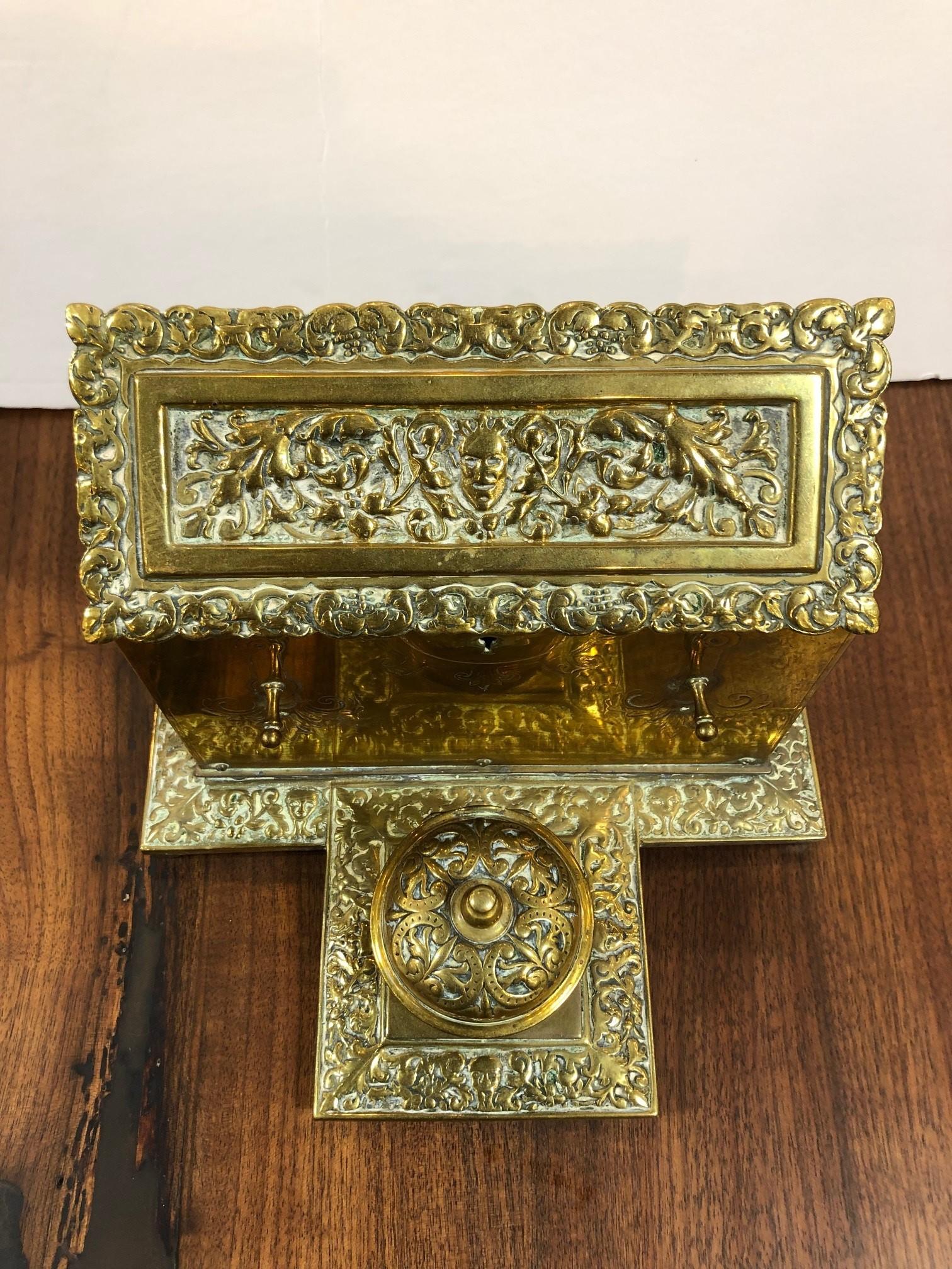 English 1850s decorative brass stationary box and inkwell with an attached lid that opens to sections for cards and envelopes. The inkwell also has an attached lid but no glass insert Together its a nice size and would look great on any desk. This