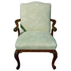 English Mid-19th Century Gainsborough Carved Lounging Chair with Cabriole Legs
