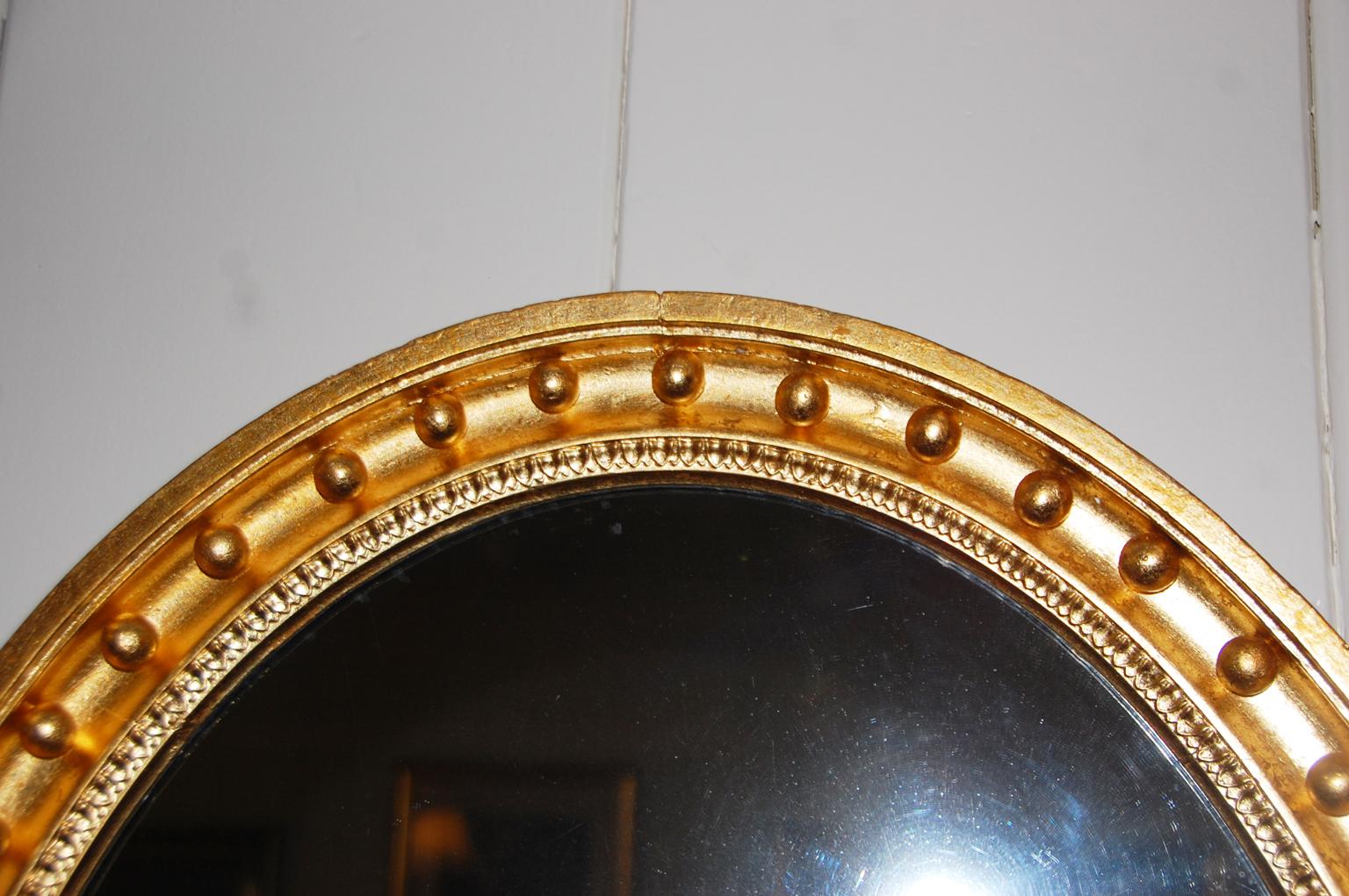 Early Victorian English Mid-19th Century Oval Gold Leaf Mirror with Balls