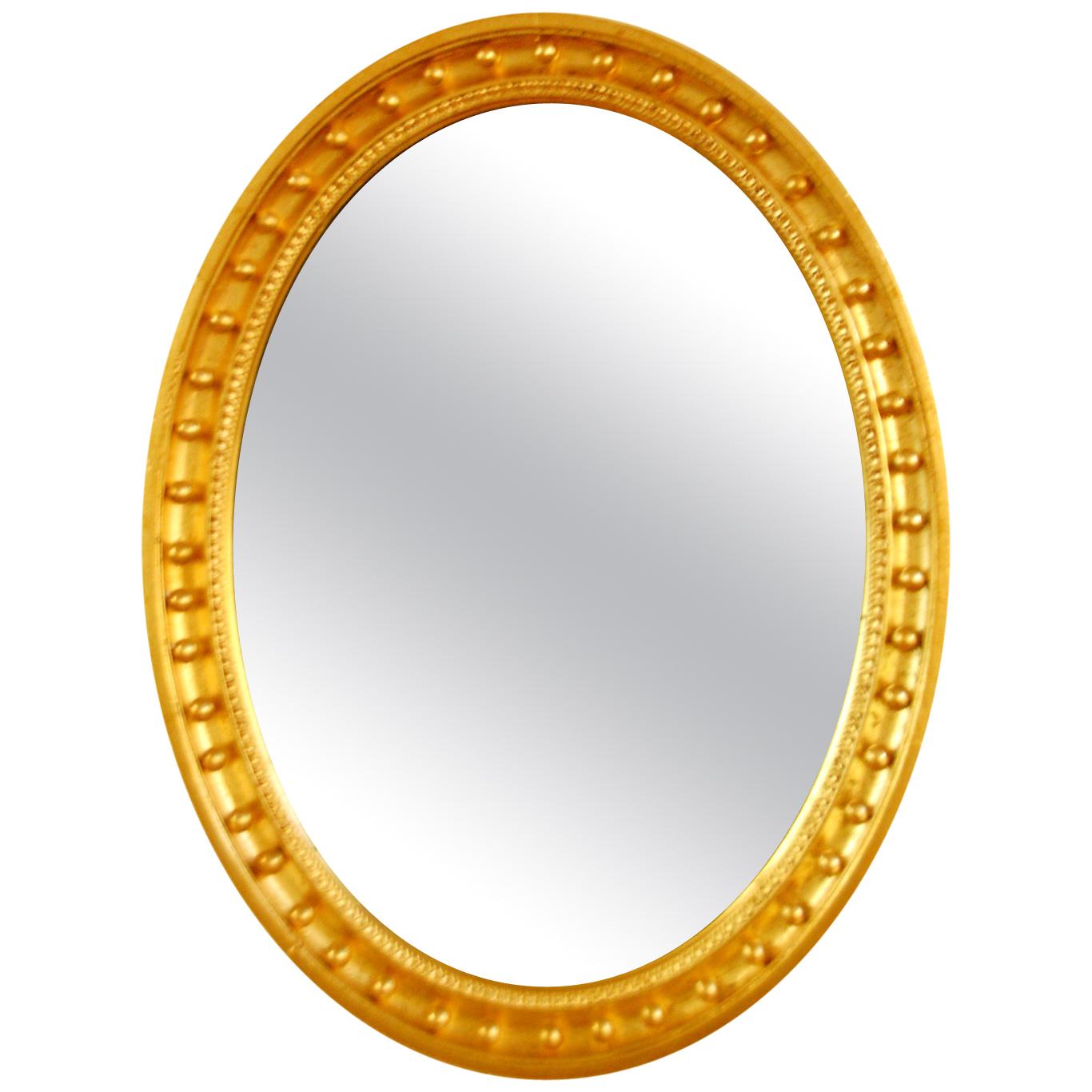 English Mid-19th Century Oval Gold Leaf Mirror with Balls