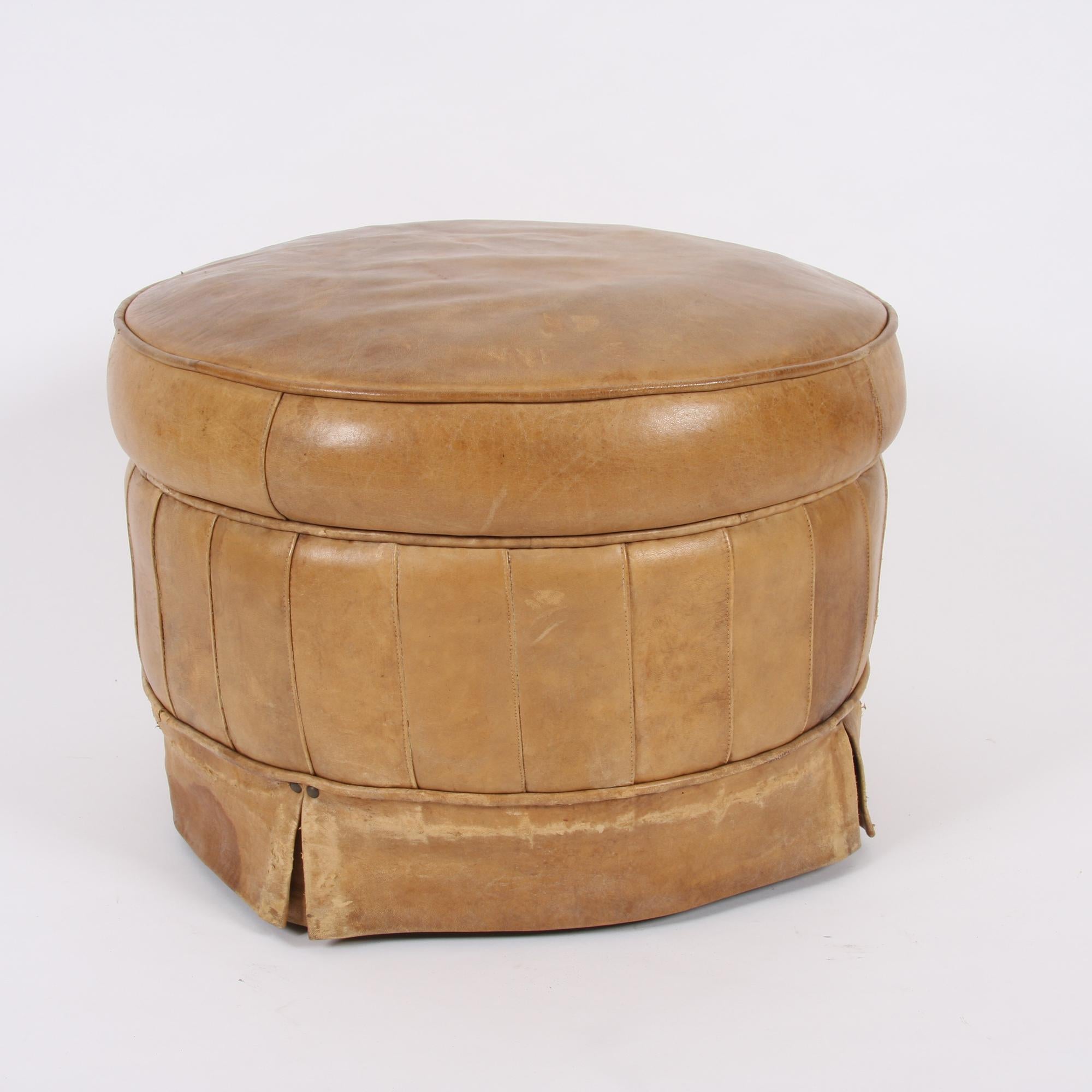 This handsome stool, with lovely worn leather and original horsehair upholstery, dates back to 1950s England.