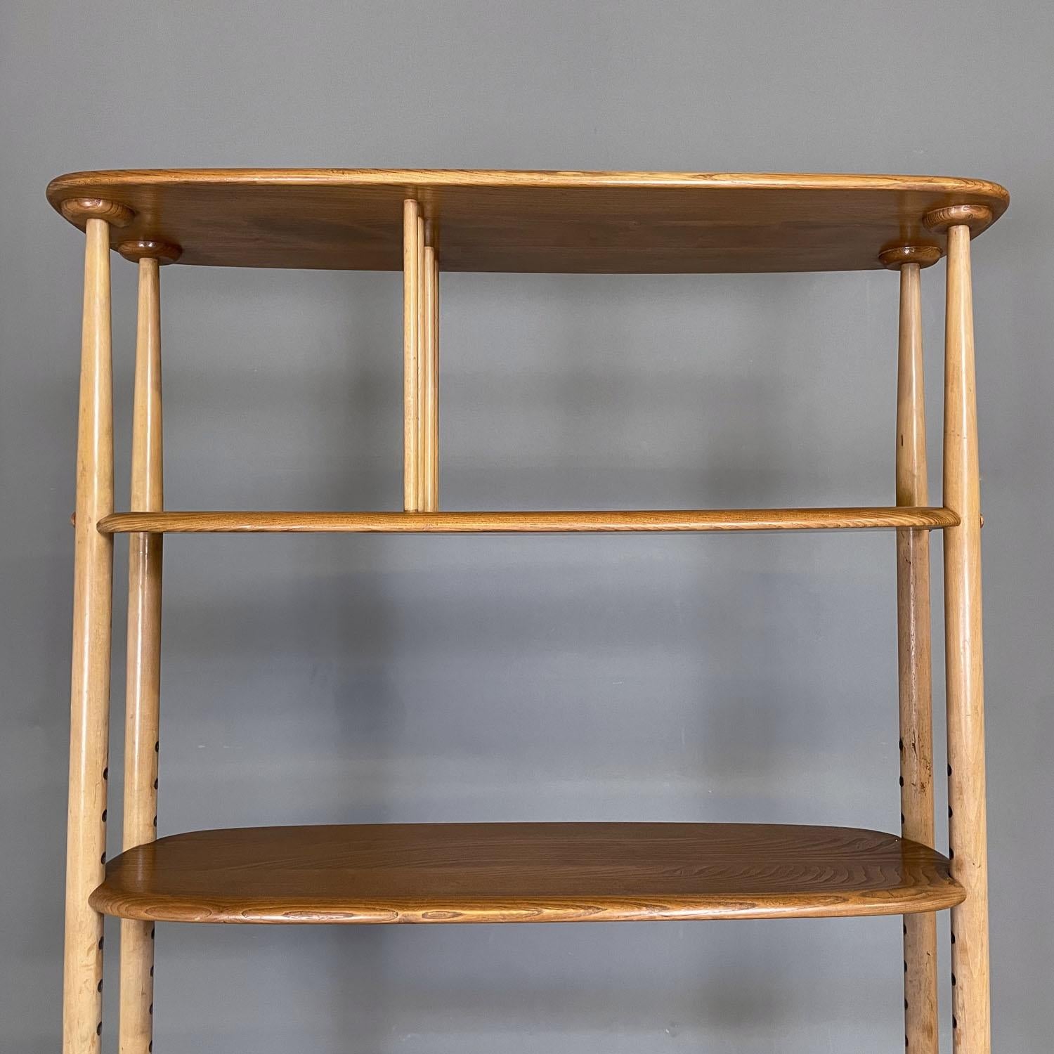 Metal English mid-century modern light wood library with cabinet by Ercol, 1960s