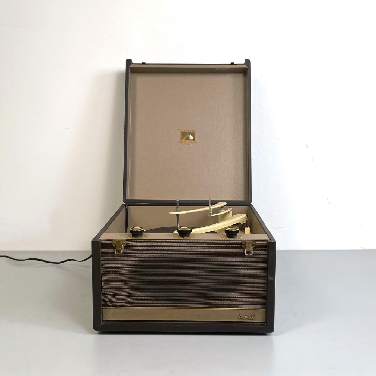 English mid-century modern vinyl record player case by His Master's Voice, 1950s
Rectangular case vinyl record player. Structure in dark and light brown wood. The record player part is located inside the case, along with its different components.