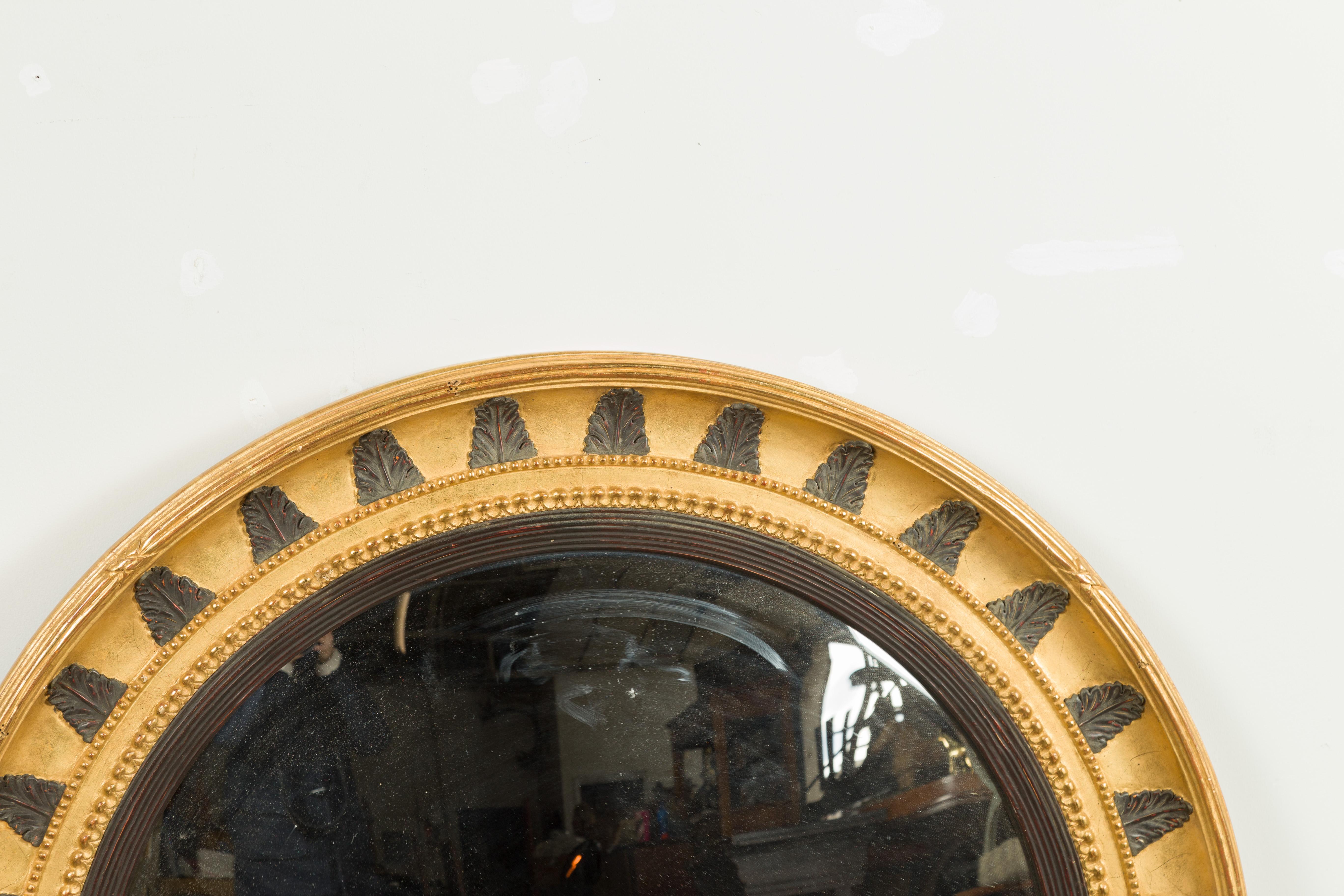 English Midcentury Bullseye Convex Mirror with Gilded Frame and Ebonized Leaves In Good Condition In Atlanta, GA
