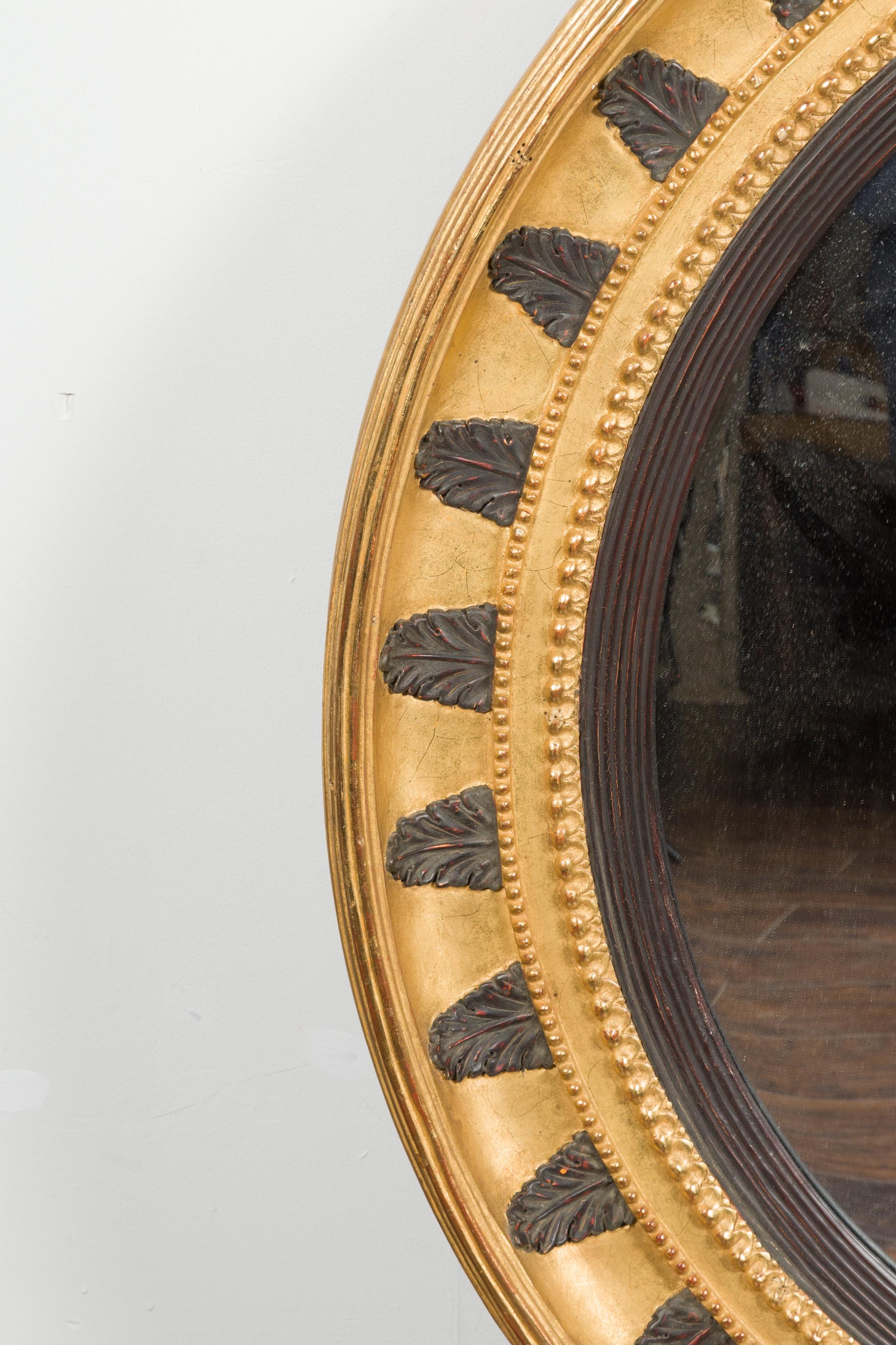 Wood English Midcentury Bullseye Convex Mirror with Gilded Frame and Ebonized Leaves