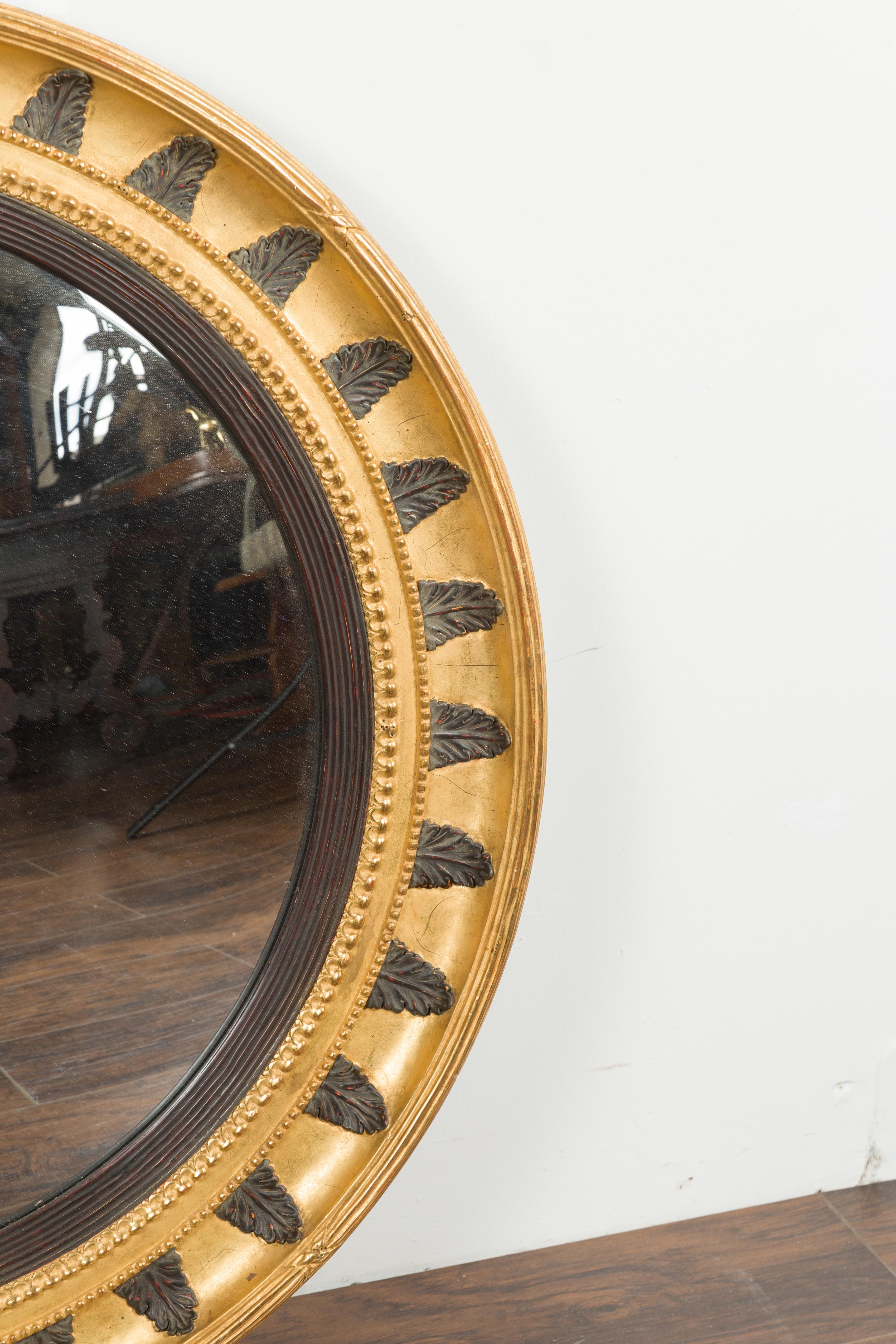 English Midcentury Bullseye Convex Mirror with Gilded Frame and Ebonized Leaves 1