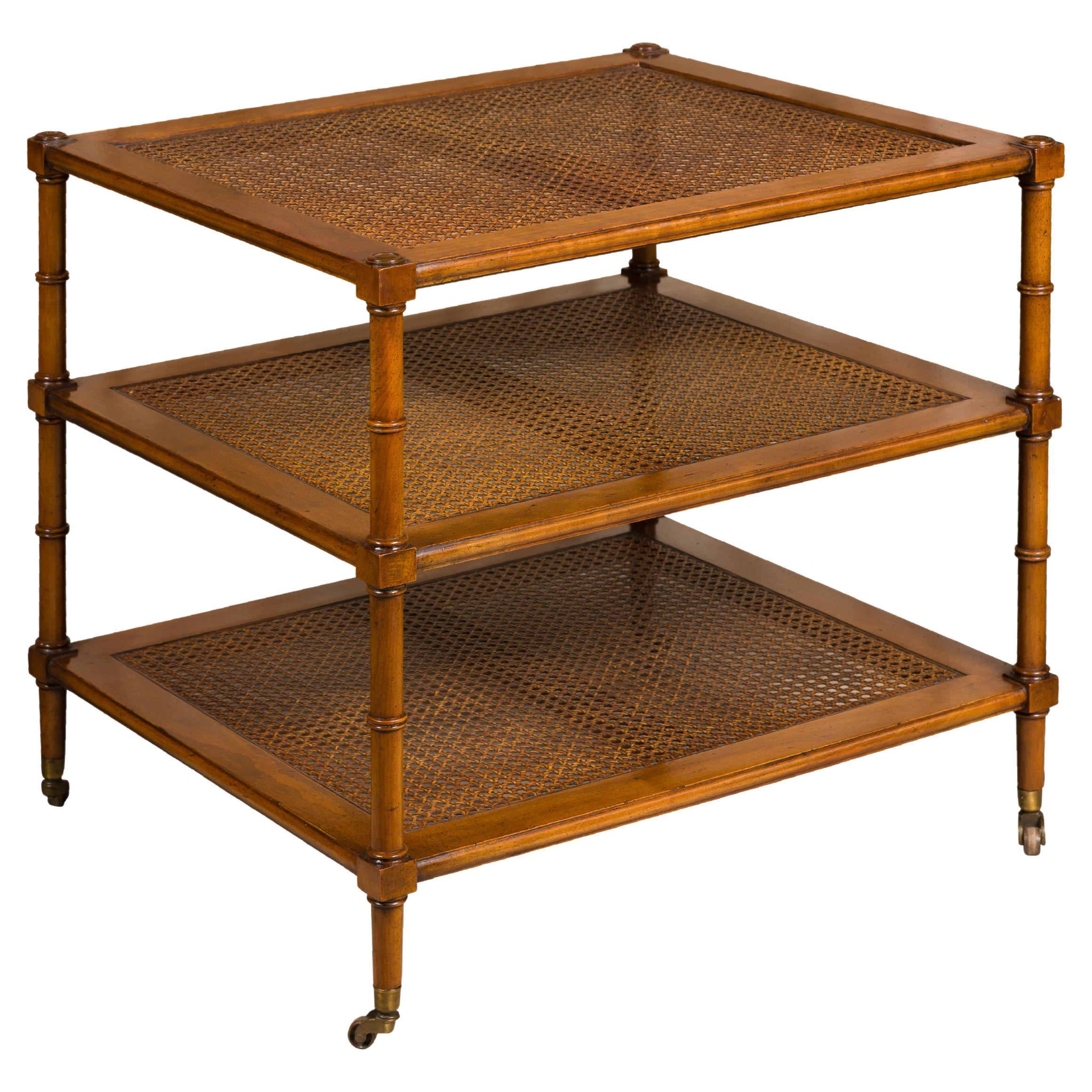 English Midcentury Faux Bamboo Tiered Table on Casters with Three Cane Shelves For Sale