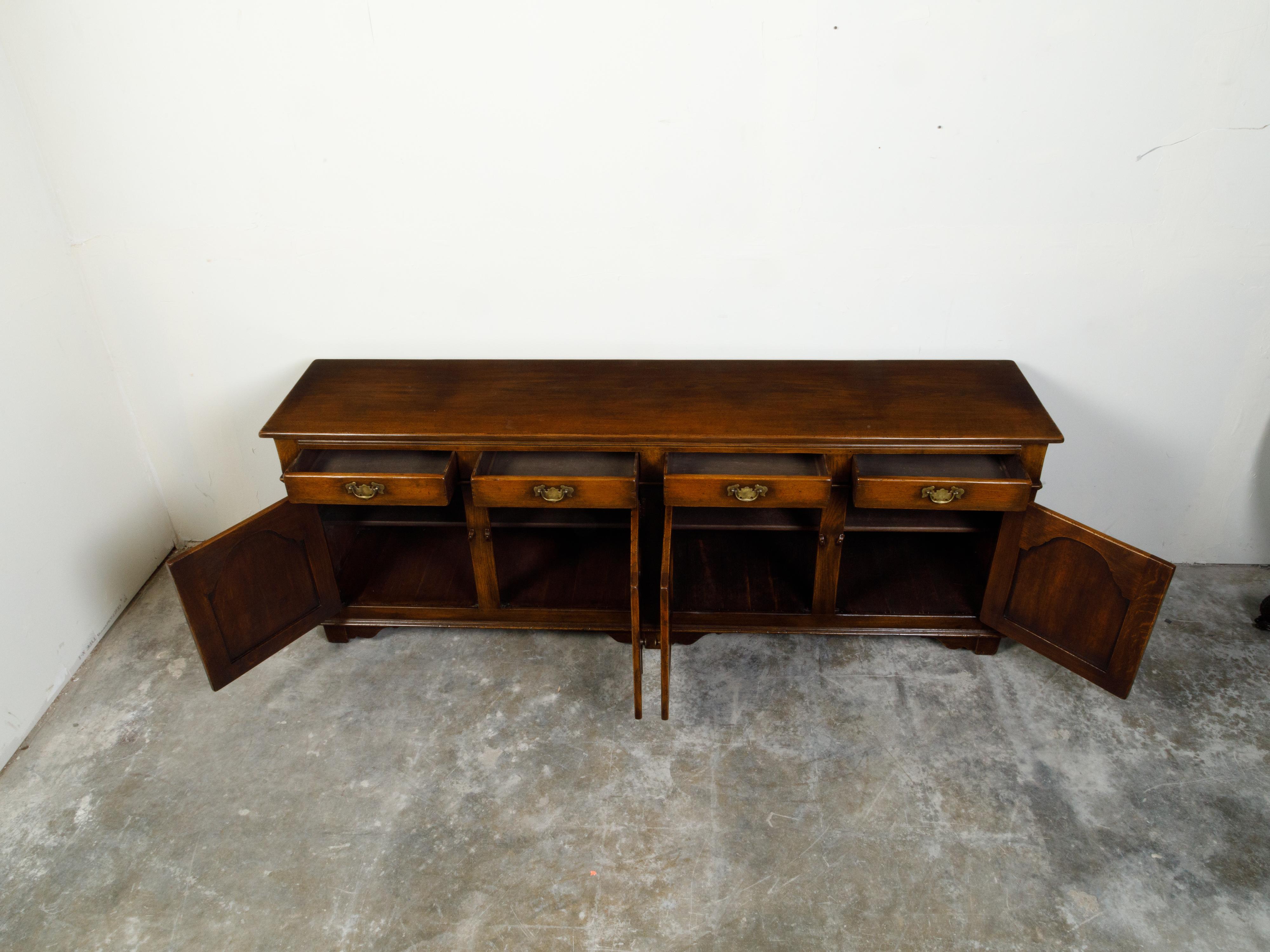 Carved English Midcentury Oak Enfilade with Four Drawers over Four Doors For Sale