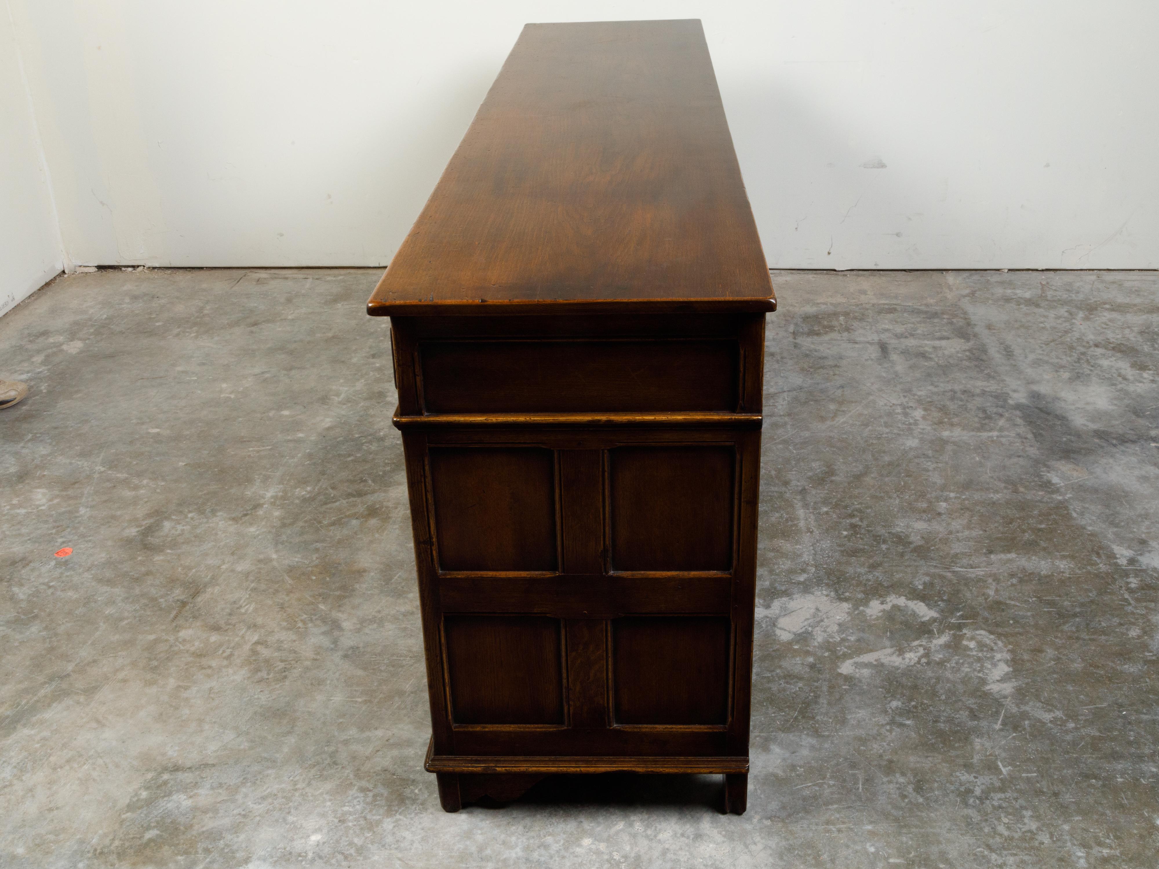 20th Century English Midcentury Oak Enfilade with Four Drawers over Four Doors For Sale